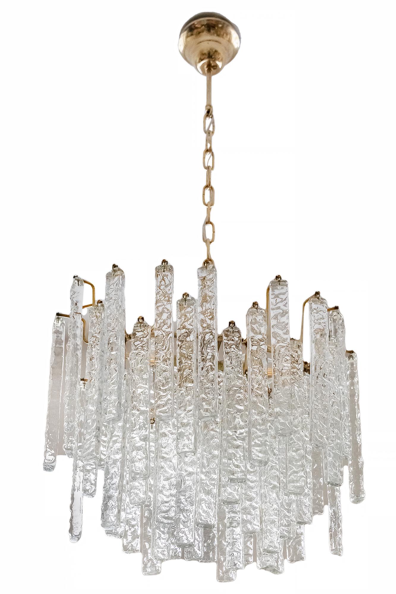 This midcentury Italian chandelier is in asymmetric oval shape, made of brass with decorative embossed clear Murano glass. 
Chandelier includes 2 pieces of E14 bulbs.
It is heavy.