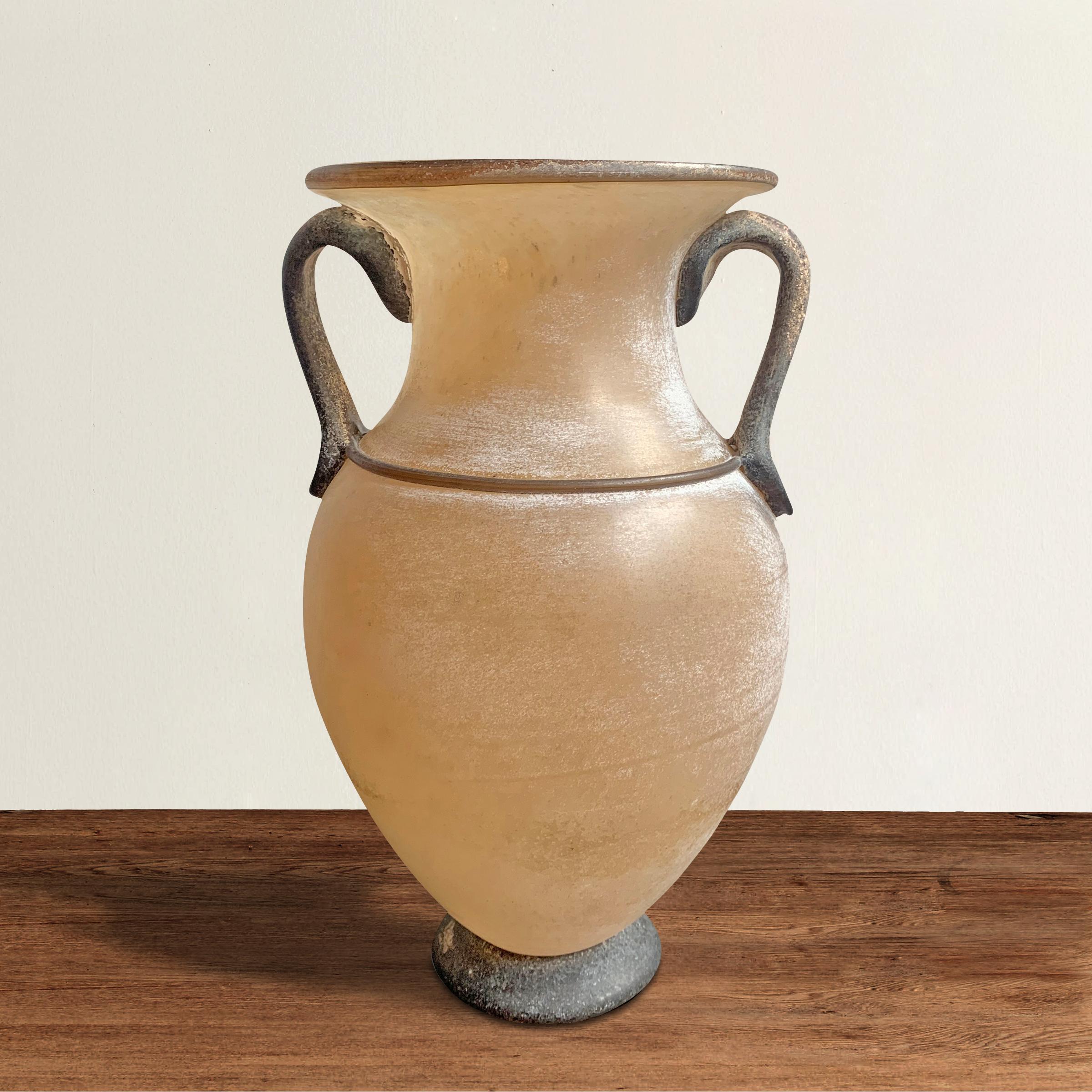 A beautiful mid-20th century Italian Murano blown scavo glass vase of Classical Greek Amphora form with two gray glass handles applied to an opaque creamy white body resting a gray glass foot. The scavo texture give the appearance of being carved of