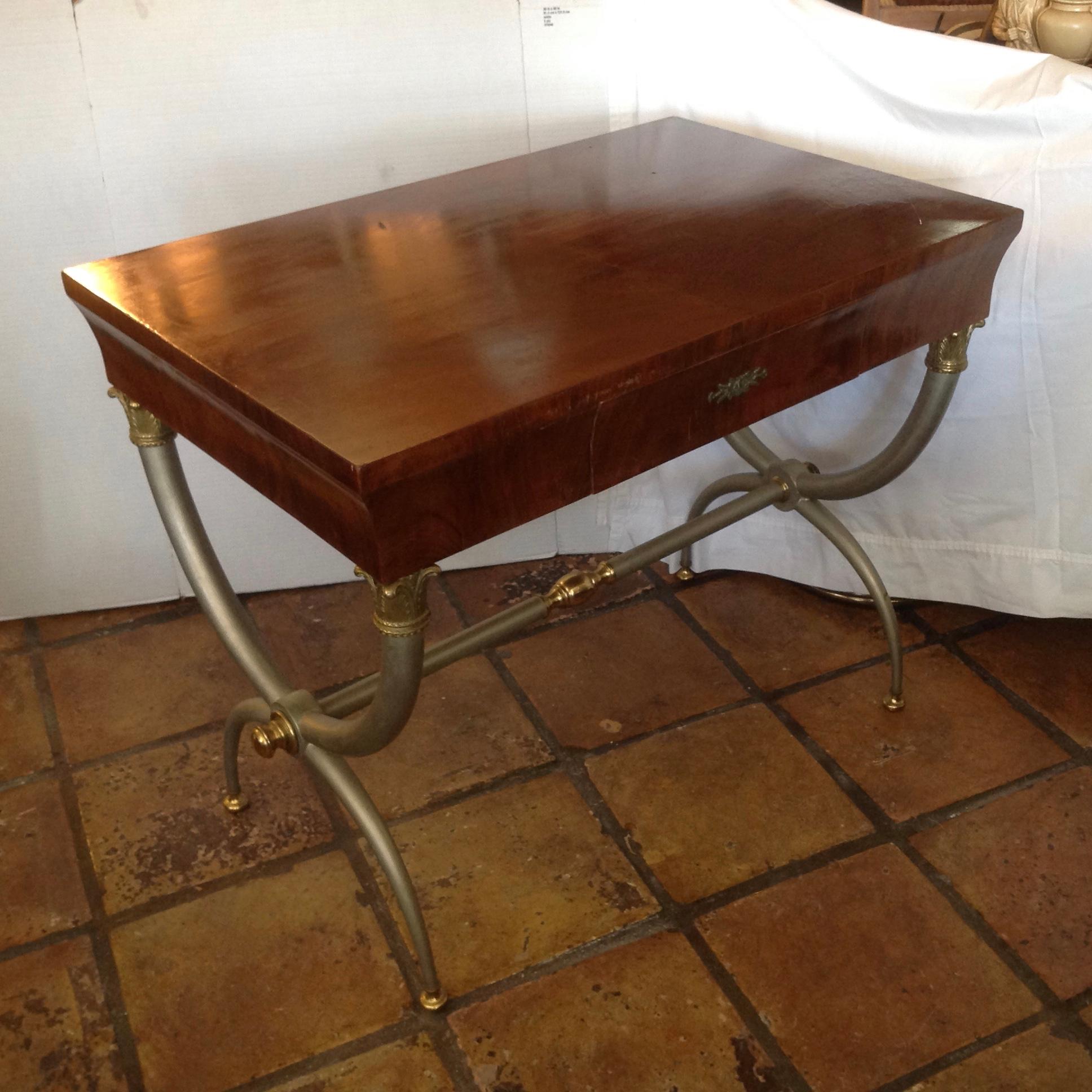 A modern interpretation of a classic form, with brushed steel, brass appointed legs.
Top is mahogany finished. The writing table is designed with a single drawer.
Wonderful design and form.