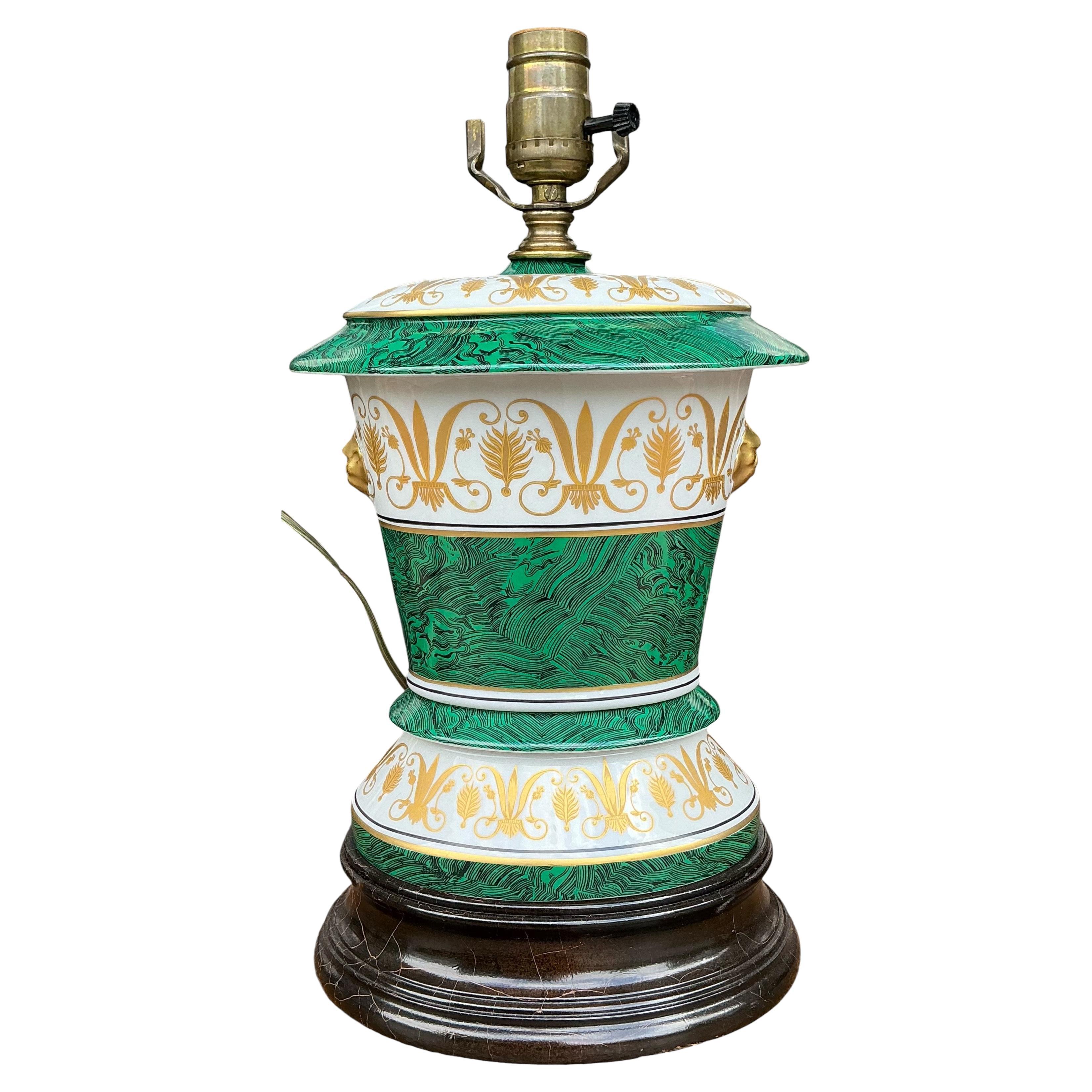 This is an Italian neo-classical style porcelain table lamp with hand applied faux malachite banding and gilt accents. It is unmarked.