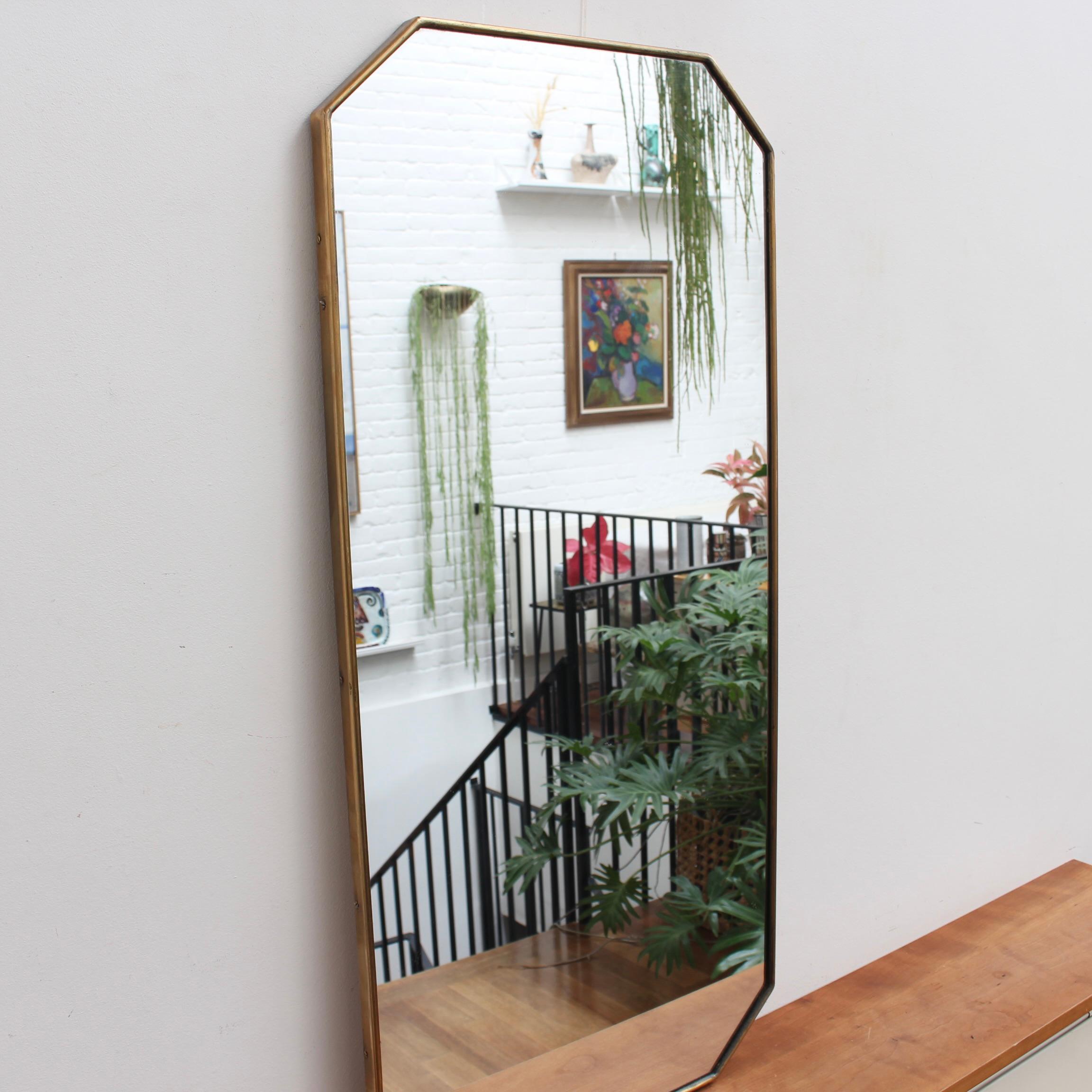 Mid-Century Italian Mirror with Brass Frame (circa 1950s). Oozing with character, this mirror is a modern, octagonal shape with elegant corners in the Gio Ponti style. The mirror is in good overall condition presenting a characterful patina on the