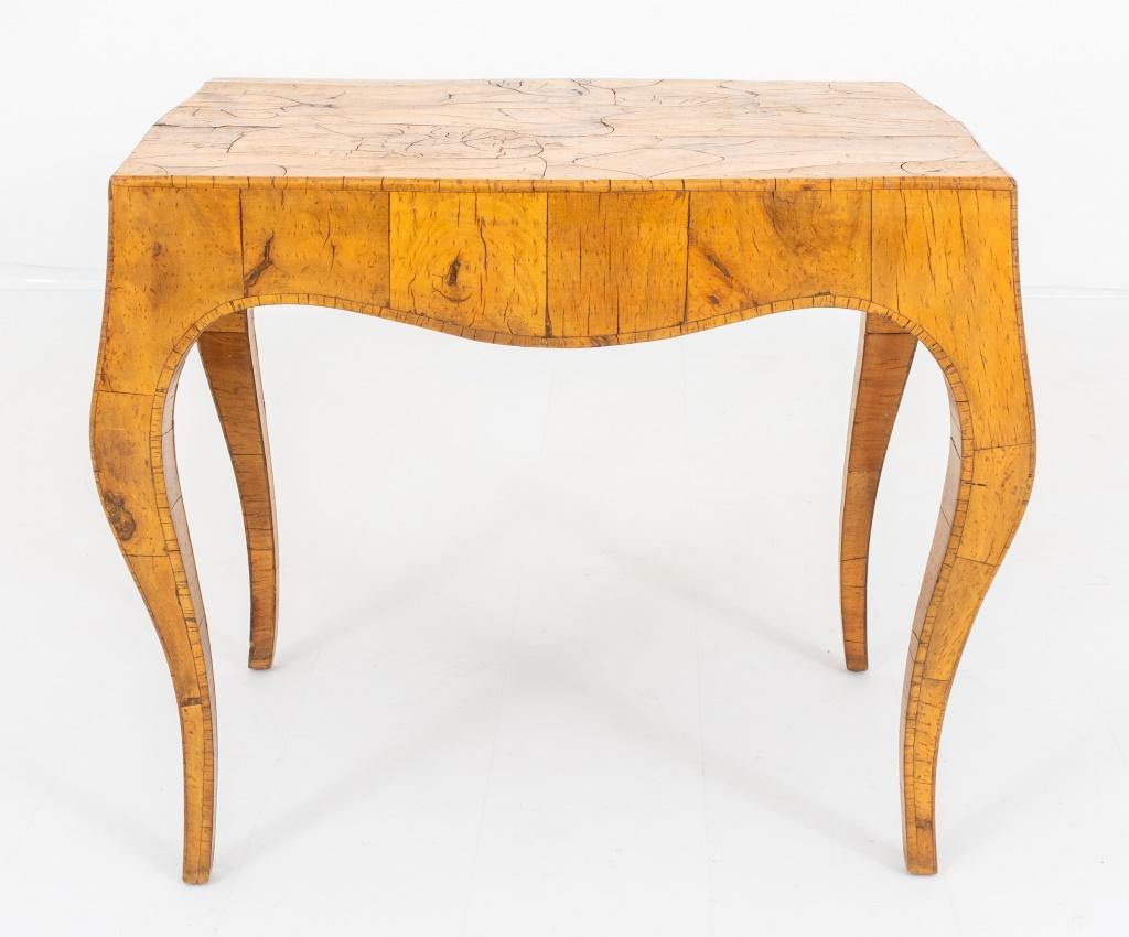 Mid-Century Italian Olivewood Veneered Table, 1960s, with shaped rectangular top and legs mosaic veneered in olivewood.

Dimensions: 22