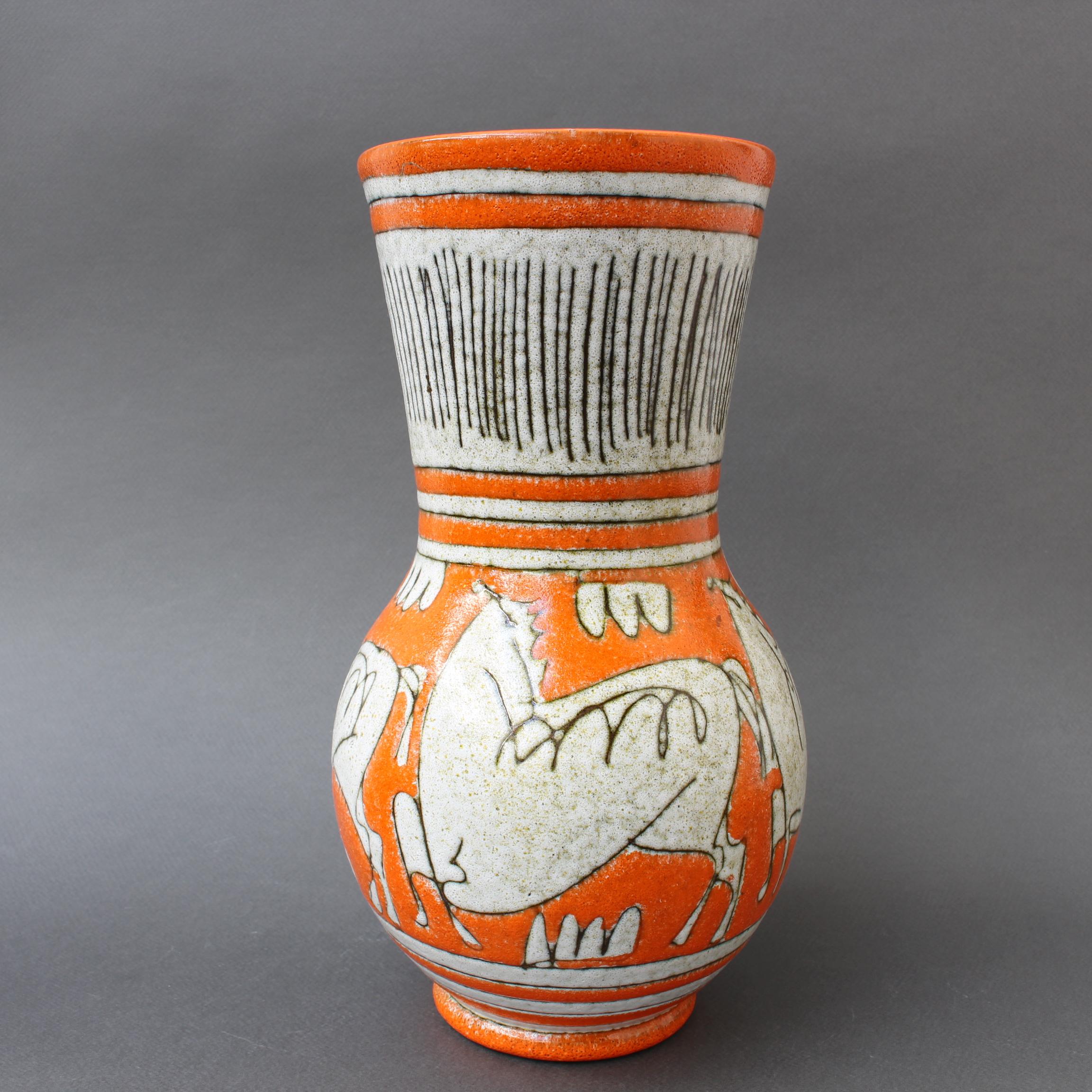 Midcentury Italian ceramic decorative vase by Fratelli Fanciullacci (circa 1960s). Vibrant orange, textural decor, primeval animals suggestive of cave drawings and an elegant form combine to create a stunning decorative vase. It will certainly