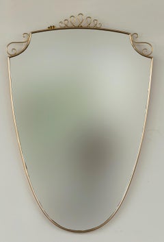 Mid Century Italian Oval Shield Shaped Mirror With Decorative Scrolls