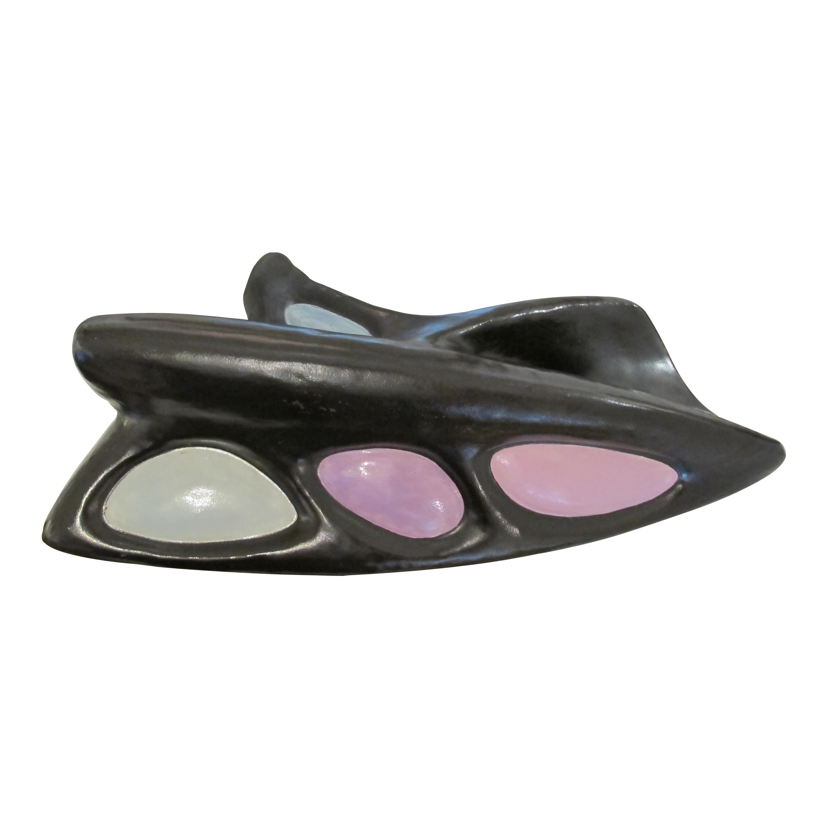 A striking Mid-Century Italian oversized ceramic door handle, dating from the 1950s. The sculptural black ceramic form features three inset glazed sections in pastel tones, light blue, lilac, and pink, creating a playful colour contrast. Supported