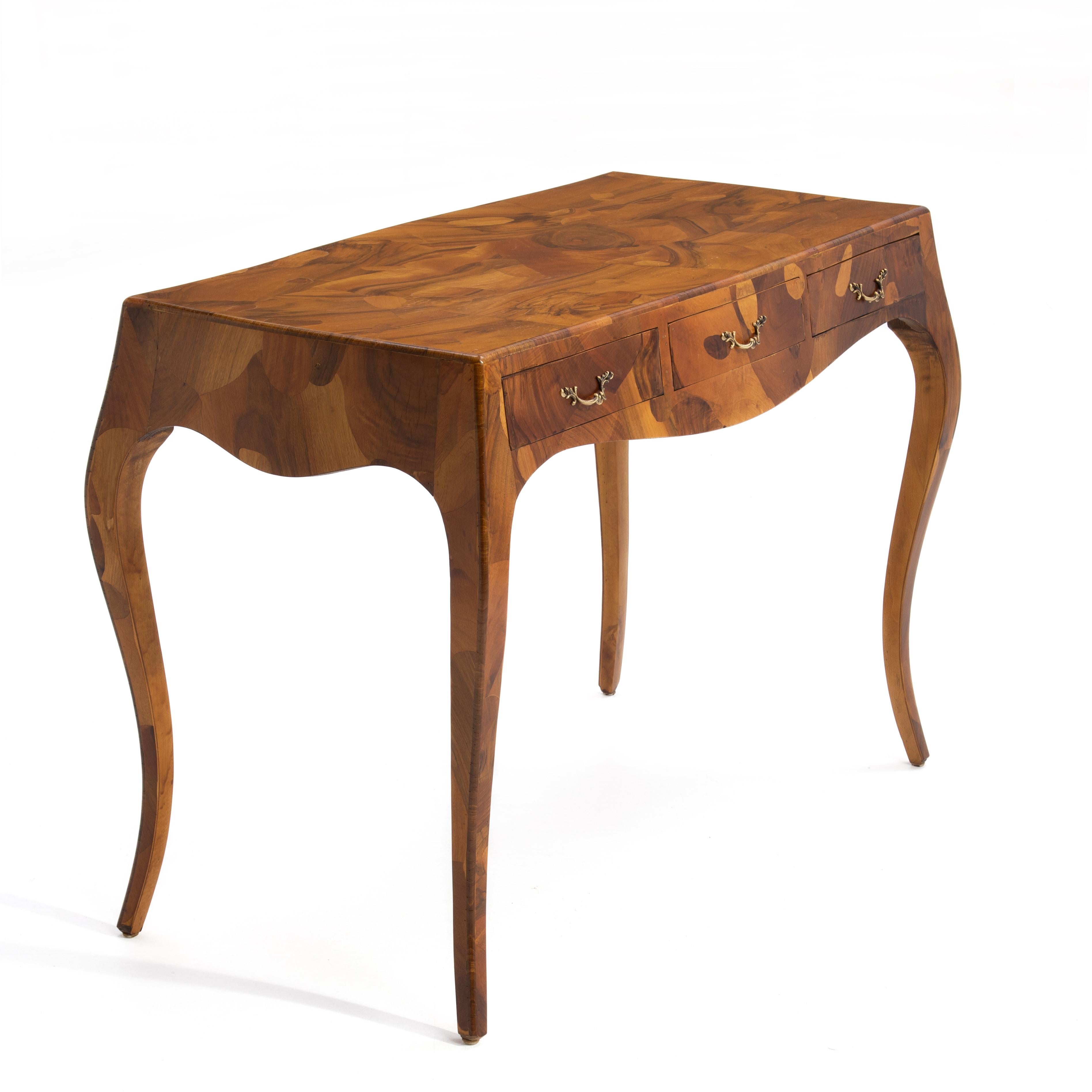 An Italian Mid-Century oyster burl olive wood three drawer writing table or desk. Brass hardware. Cabriole legs. Stunning.

The writing surface is 39 1/4