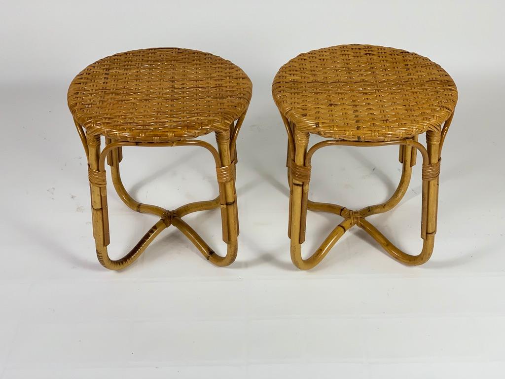 Pair of round tables or stools in bamboo rattan with woven top with basket-shaped legs.
Italy Mid-Century Modern, 1950s.
 