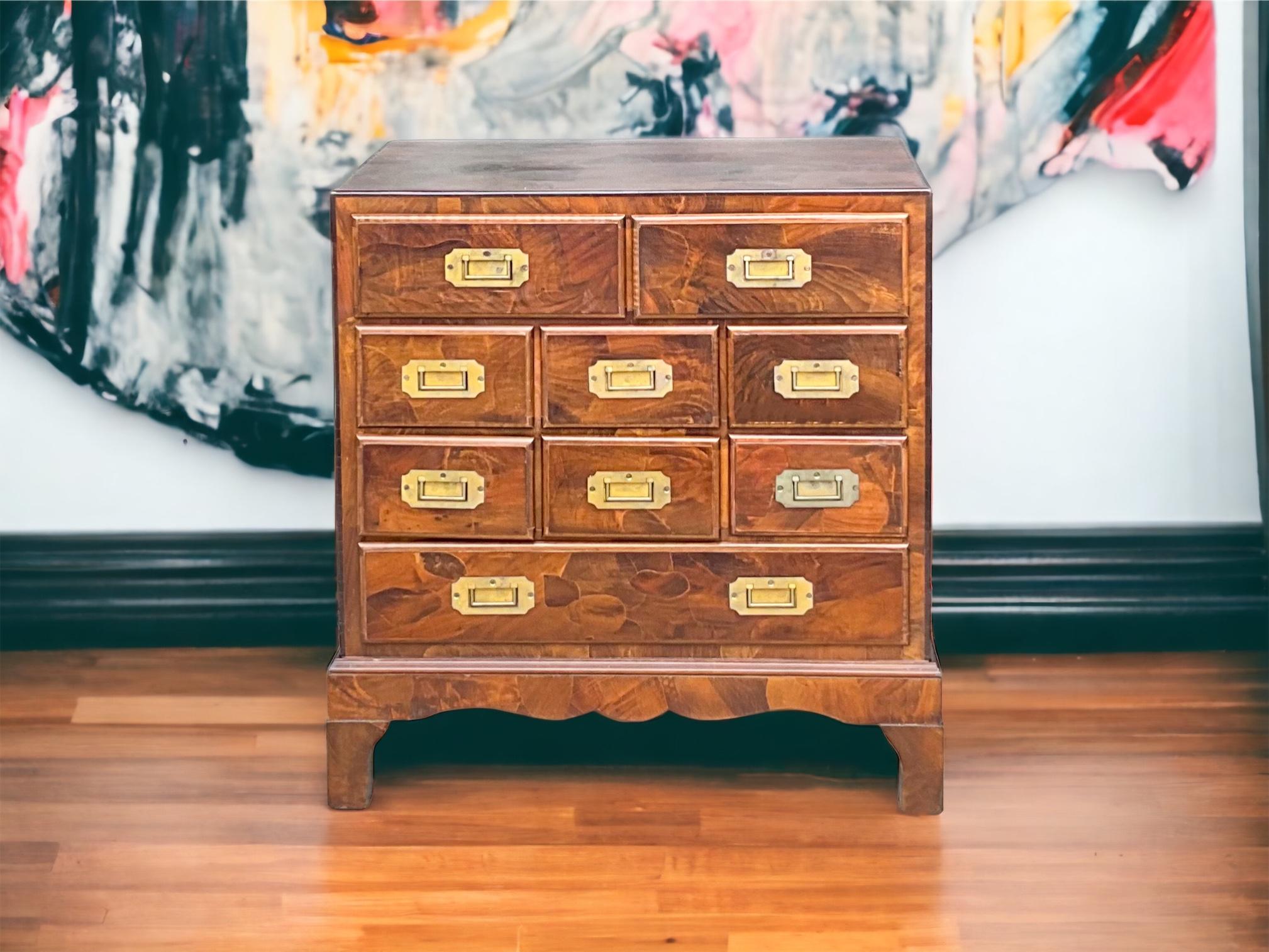 This is an Italian patchwork burl petite chest or commode or even a side table with campaign styling. The piece is a rich patchwork burl, a particular favorite of mine. It is in very good condition and marked. 