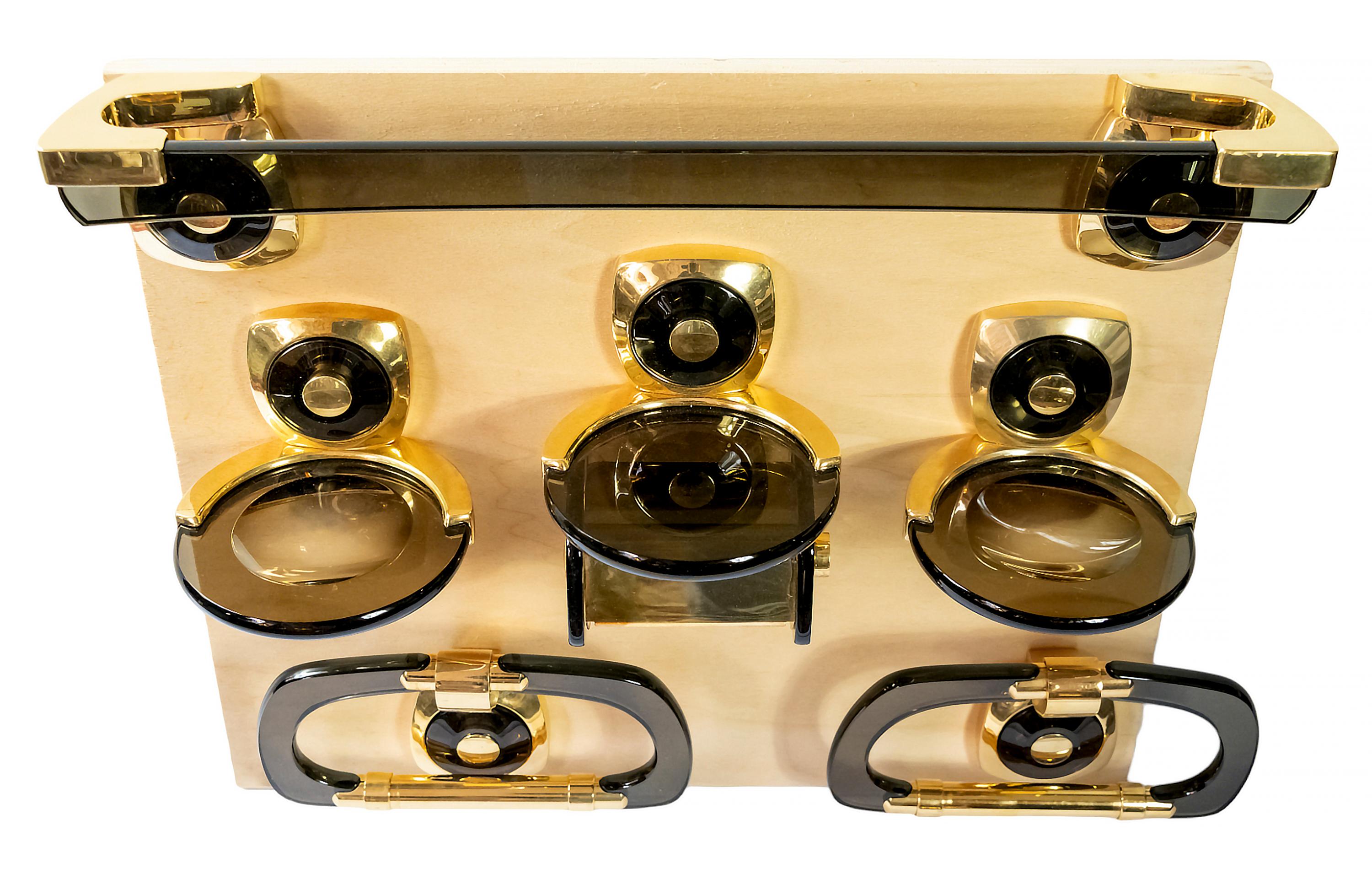 Mid-Century Italian set of bathroom fixtures/accessories from 1970's.
Created in a very solid design. Made from a thick dark brown color plexiglass and gilt brass joints. This set includes 6 pcs. of different accessories.
Dimensions:
Towel rack (1