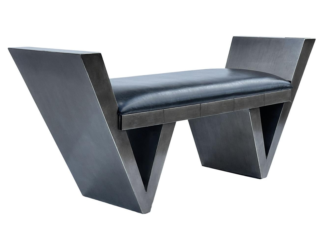 A sleek post modern design from Italy circa 1990's. It features heavy solid wood construction with gunmetal lacuer and black vinyl seat cushion. Very good overall condition.