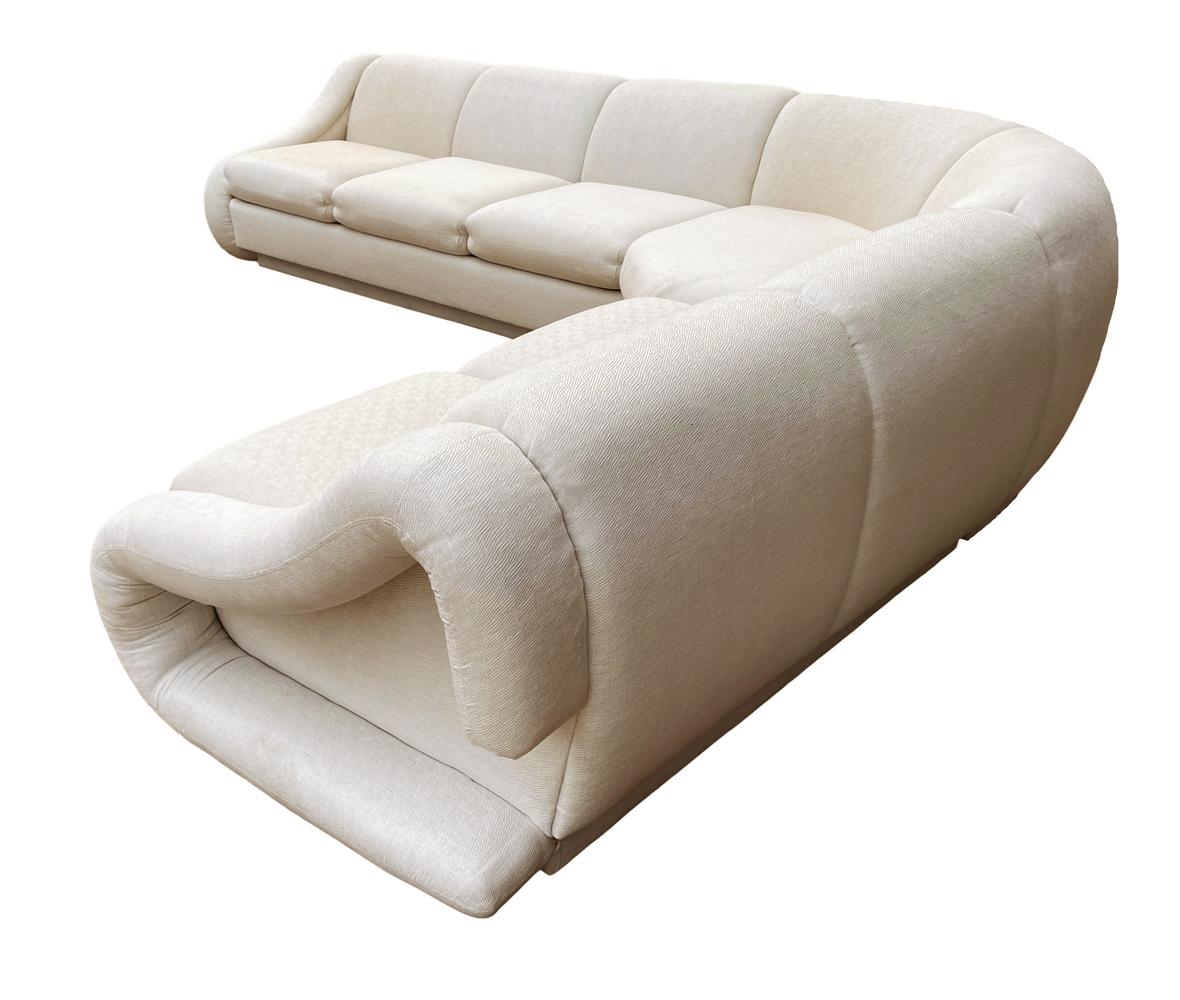 An awesome vintage sofa with an Italian design aesthetic. This was made in the 1980's by Weiman and has 3 sections. Heavy finely made sofa. Fabric is original and is in great shape except for one small tear on the back. Seat depth is 24 inches.