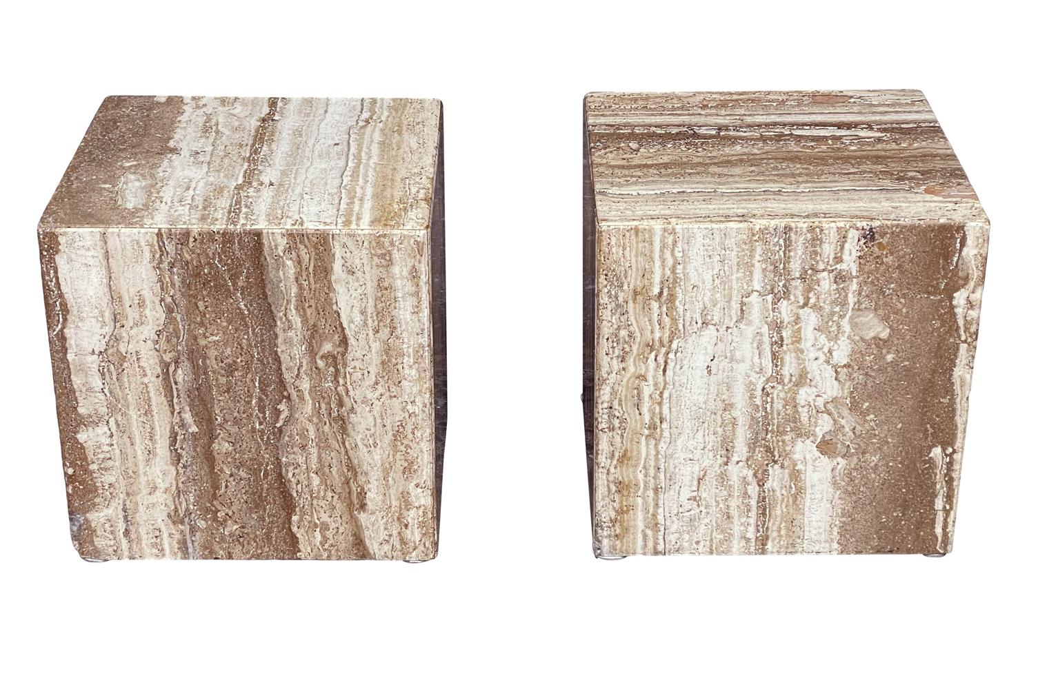 A simple pair of Classic cube tables from Italy circa 1980s. These feature solid travertine construction. Price includes the pair as shown.