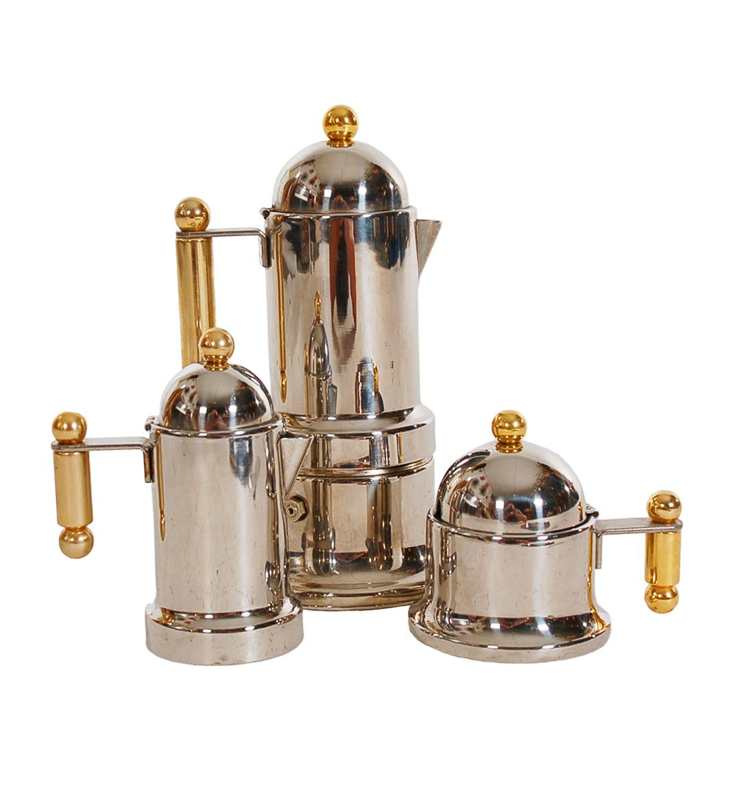 A vintage, unused, stovetop espresso maker from Italy circa 1970s. It features all stainless steel and brass construction. Comes with espresso maker, creamer, sugar caddy, and tray as shown.