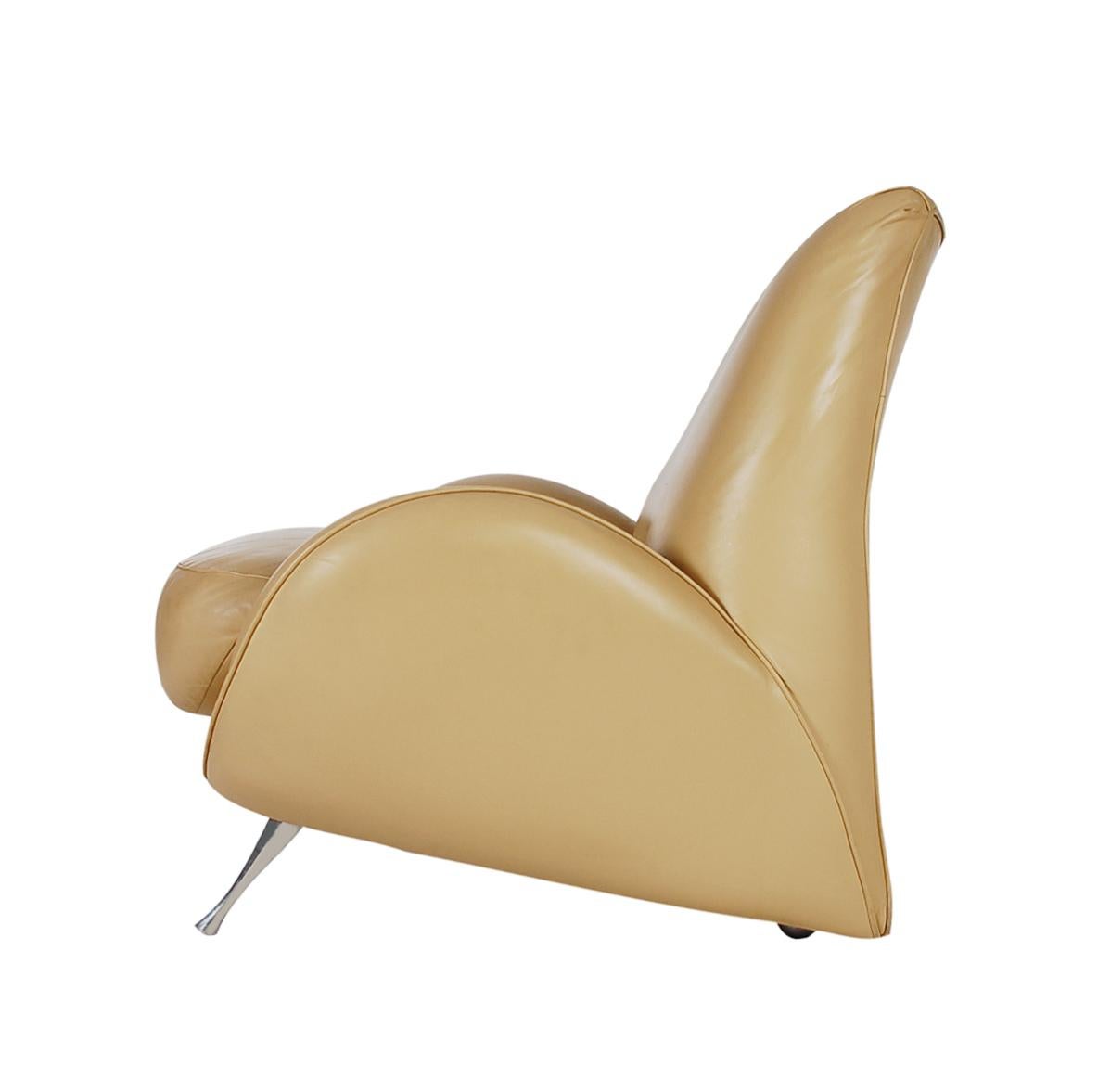 A Postmodern designed chair from Italy and produced in the 1980s. It features a streamline Art Deco design is soft butterscotch leather with stainless legs.