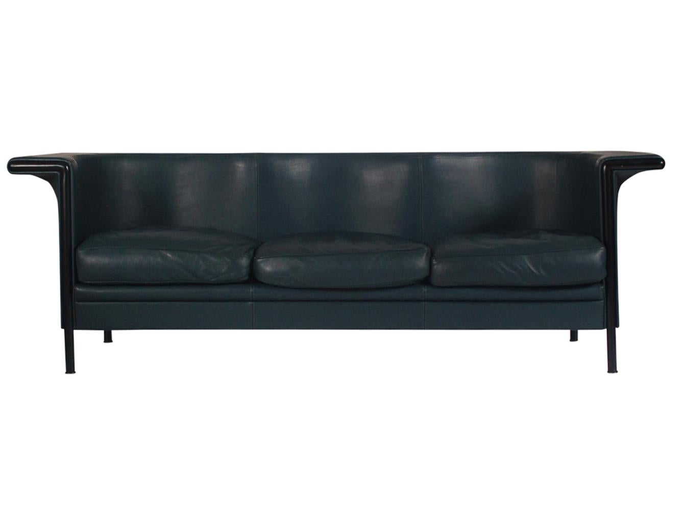 A sleek Postmodern design by Antonio Citterio and produced by Moroso in the 1990s. It features a black satin powder-coated frame with a dark blue-green leather. Fully labeled. Well cared for and free of damages.