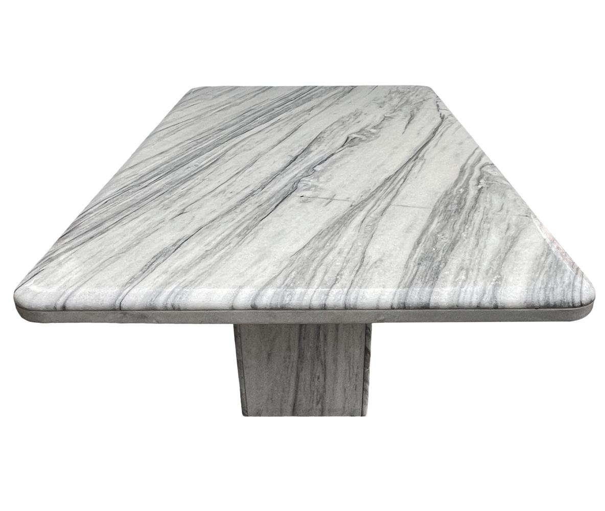A large and impressive dining table from Italy circa 1980's. It's constructed of heavy slab Italian marble with beautiful veining.