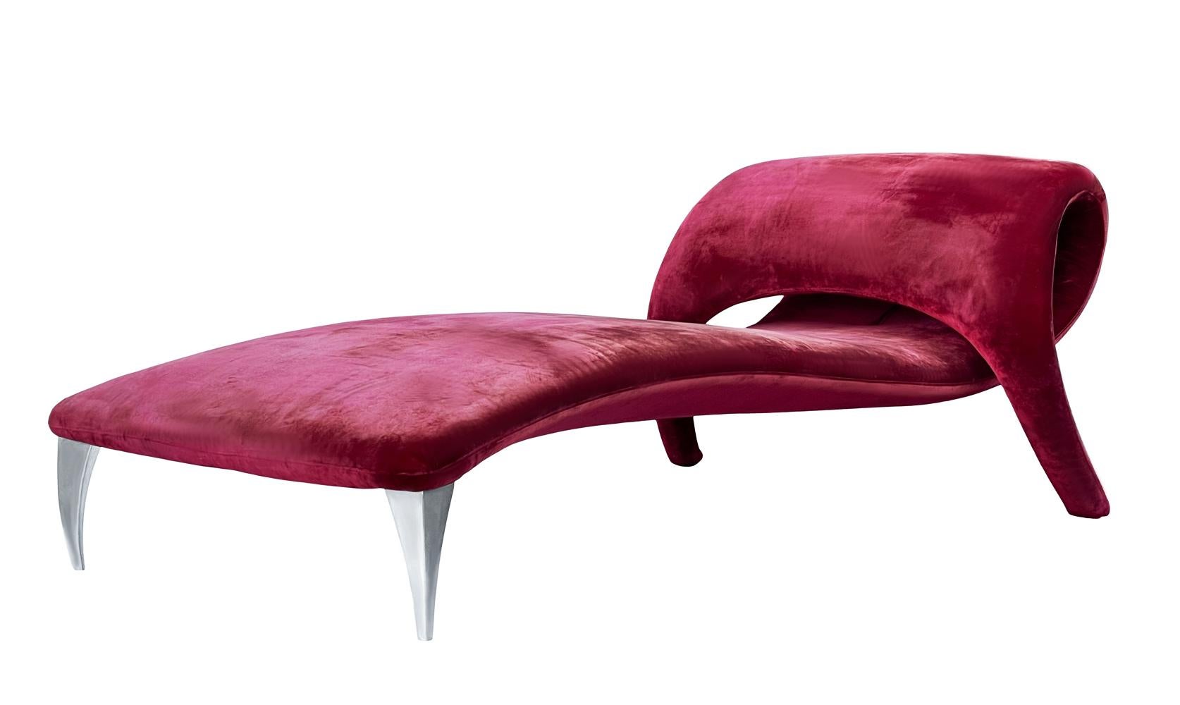 An incredible designed and constructed chaise lounge from Italy circa 1990's. It features a heavy steel internal frame, red velvet upholstery and polished stainless legs. Fabric is original and tired looking, so reupholstery is recommended.