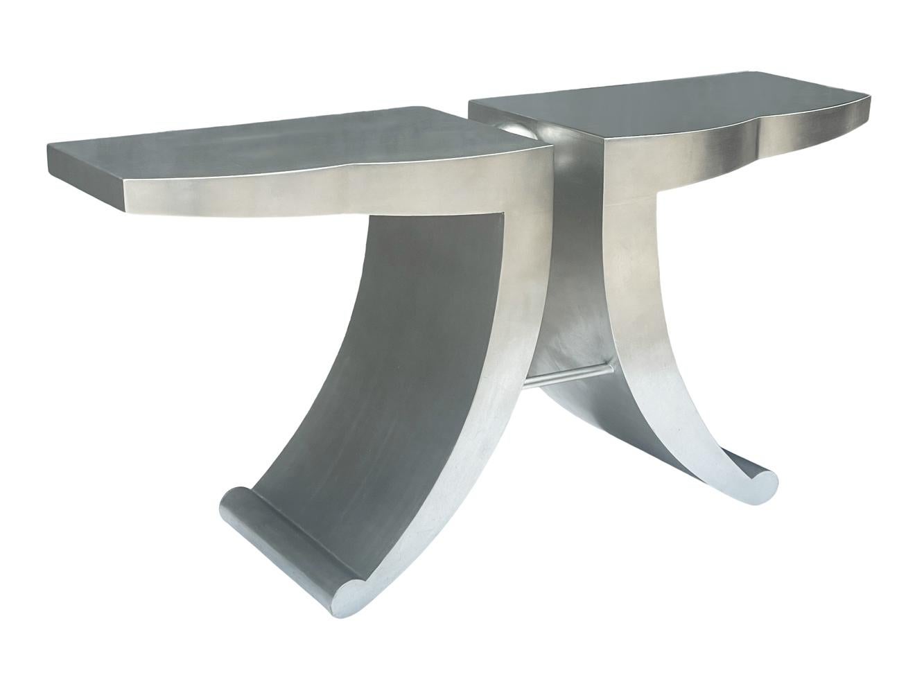 A funky design console table from Italy circa 1990's. It features silver leaf wood with steel construction accents.