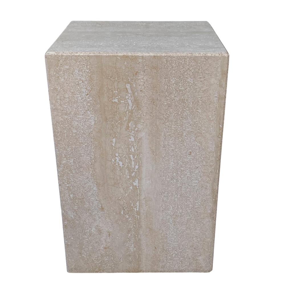 A simple modern cube table from Italy circa 1970's. It features thick cream colored travertine construction. Very good ready to use condition. 