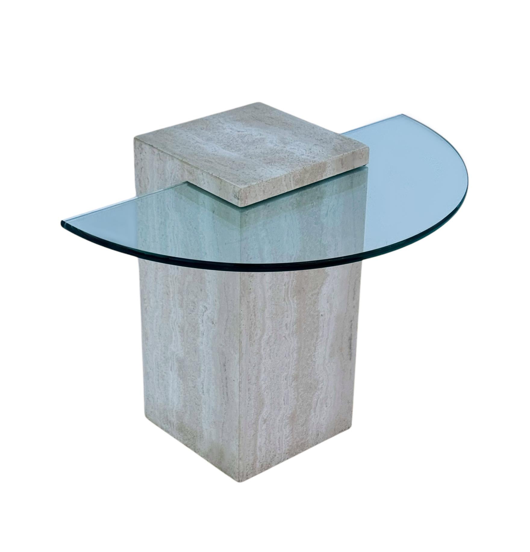 A simple modern cube table from Italy circa 1970's. It features thick cream colored travertine construction with clear inset glass top. 