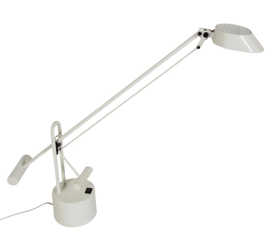 A sleek matching pair of desk lamps made in Italy, circa 1980s. These well-made lamps features a geared articulating design with bright white enamel finish. Both were tested and working. Price includes the pair.