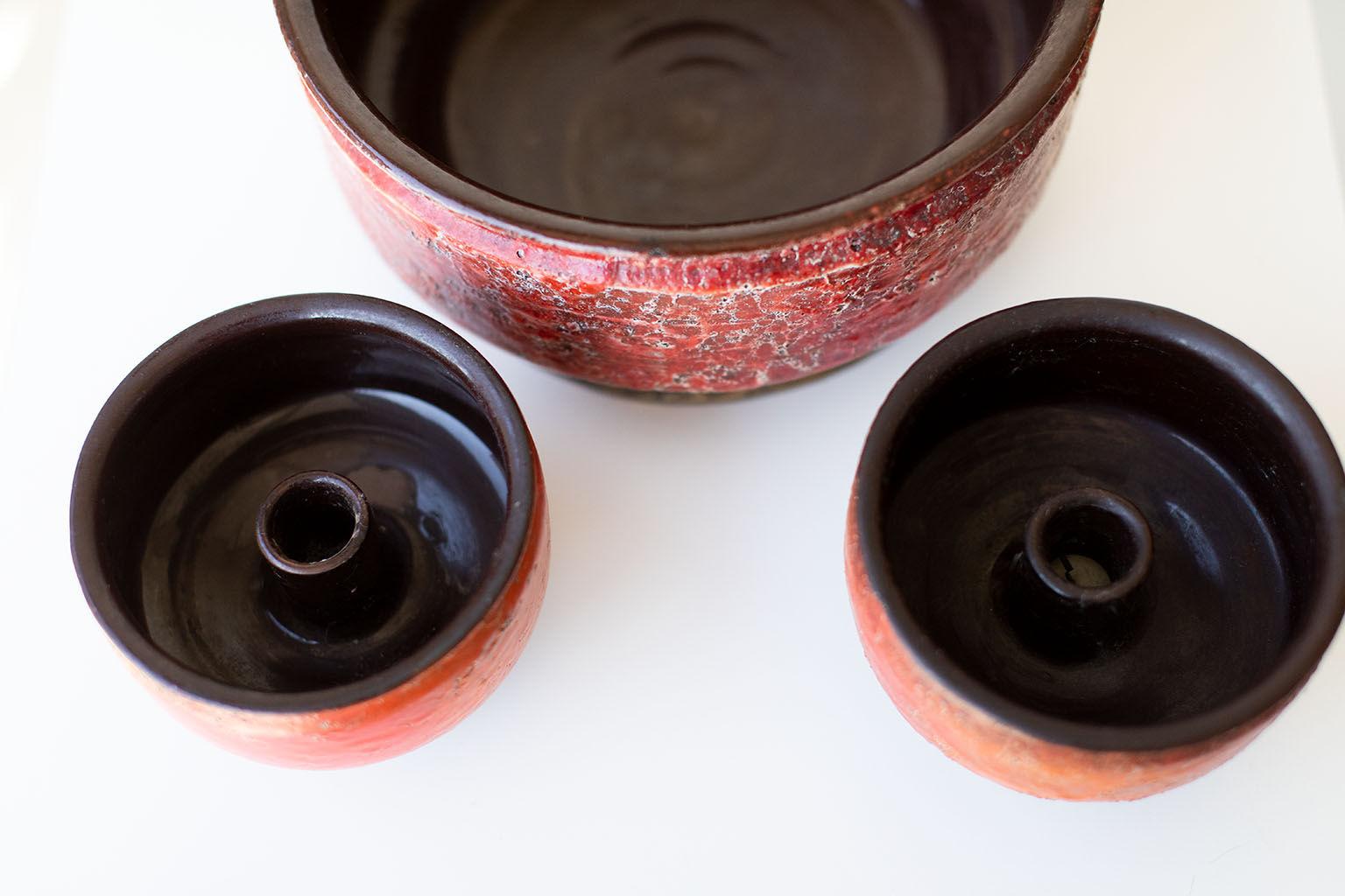 Designer: Unknown

Importer: Raymore
Period/Model: Mid-Century Modern
Specs: Pottery


These mid century Italian pottery candle holders are in vintage condition. One of the vessels has a small chip to the top which has been painted