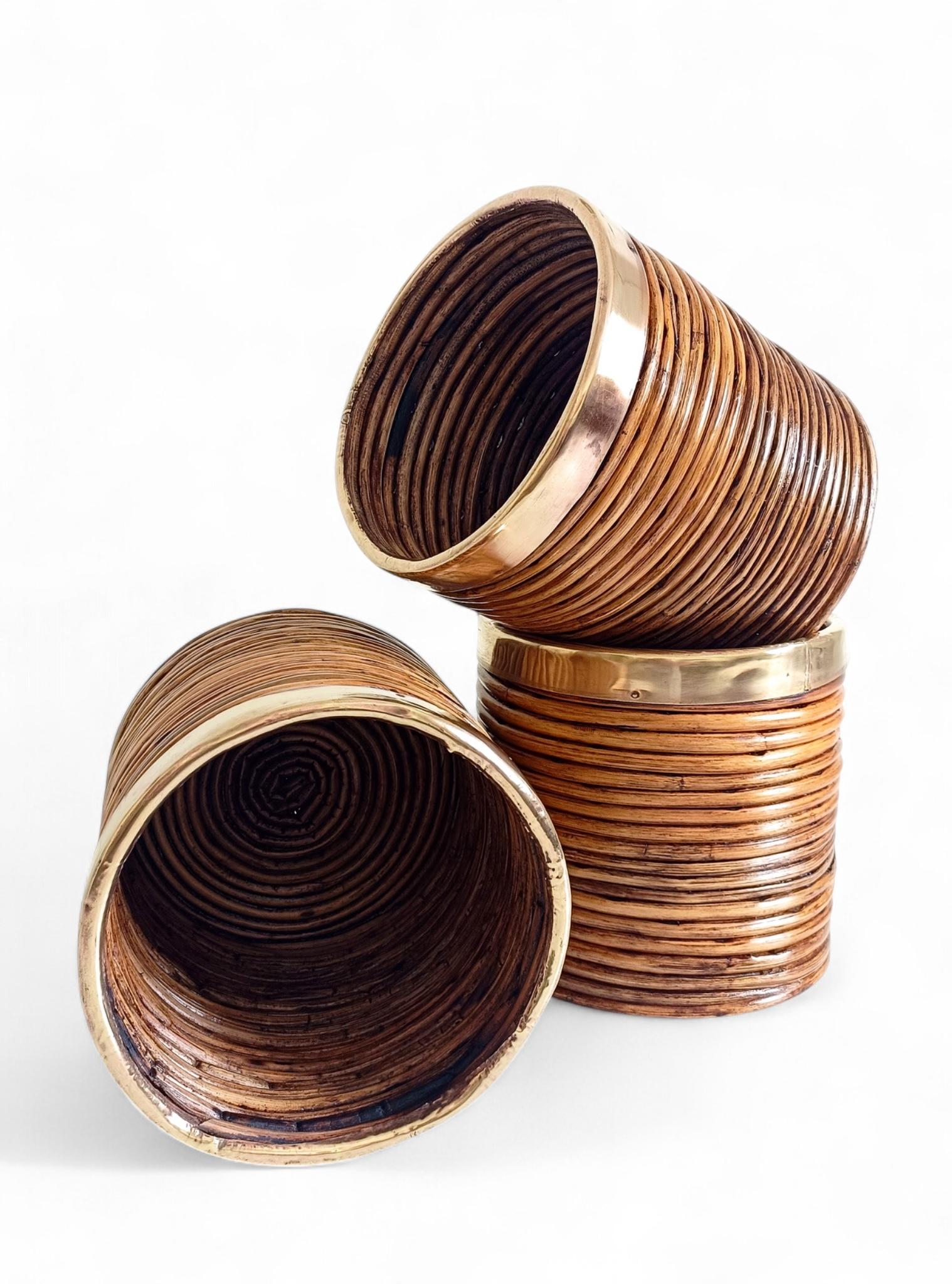 Mid-Century Italian Rattan and Brass Planters, in the Style of Vivai del Sud, G. Crespi, or Franco Albini, 1960s–1970s

A beautiful trio of Mid-Century rattan and brass planters, handmade in Italy circa the 1960s–1970s. Their design recalls the