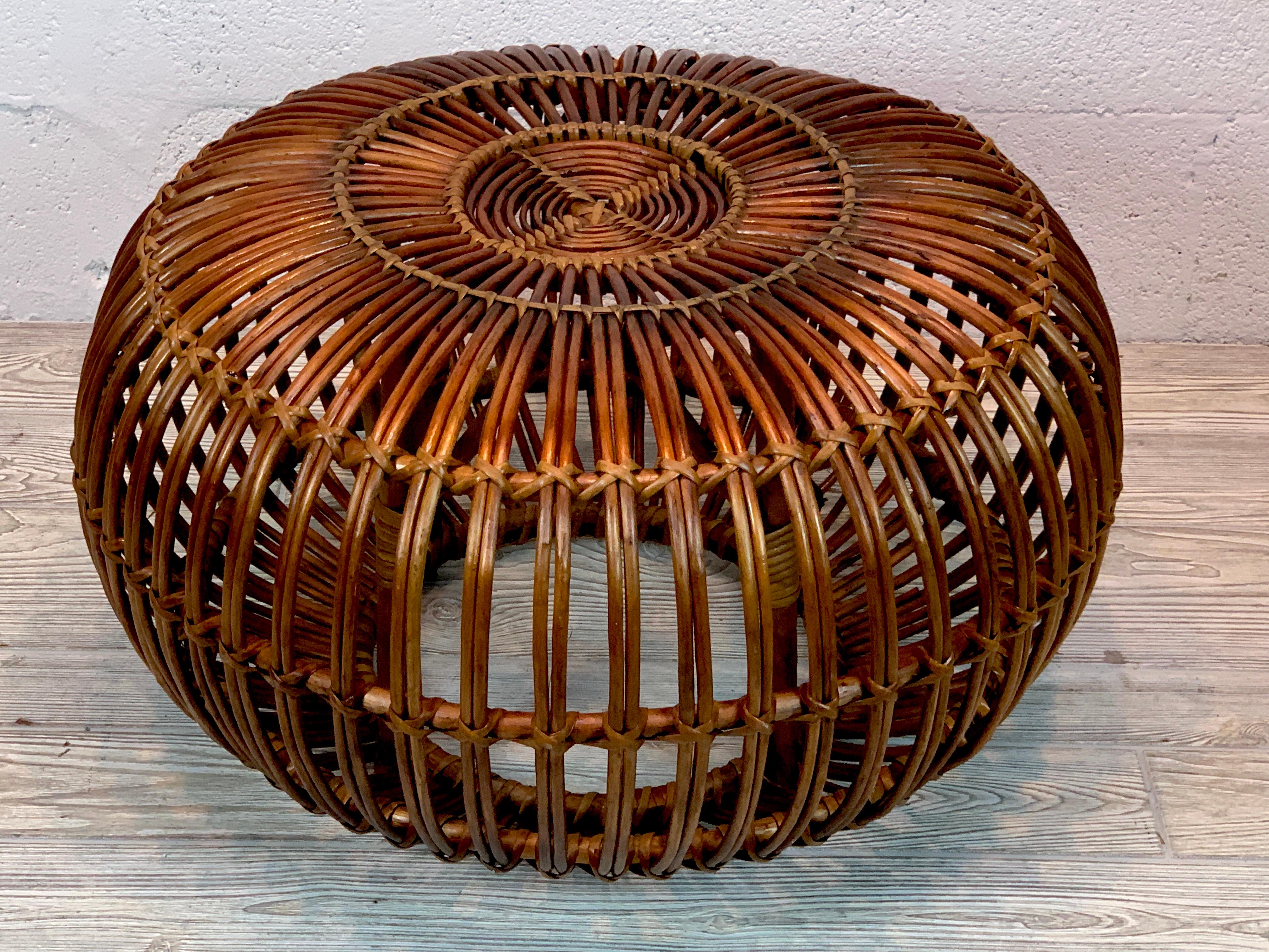 Mid-20th century woven rattan ottoman, pouf or stool designed by Italian designer Franco Albini. A fine period example, great color and sturdy. 
  