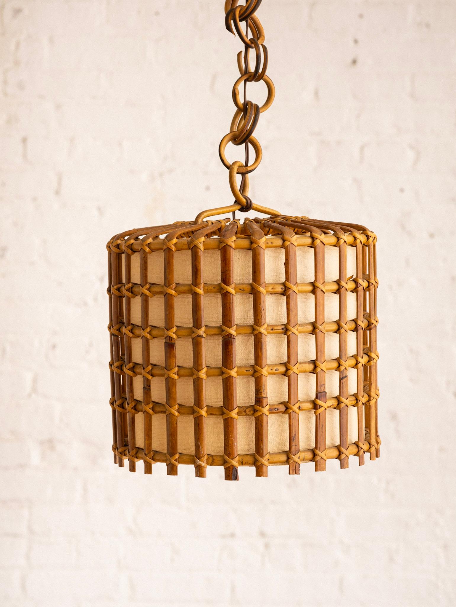 Mid century Italian pendant lamp with inner paper shade. Grid form, with rattan chain and rush ceiling canopy. Sourced outside of Florence, Italy.

Additional Measurements:
37” in height total with rattan links and canopy.
Links and canopy add