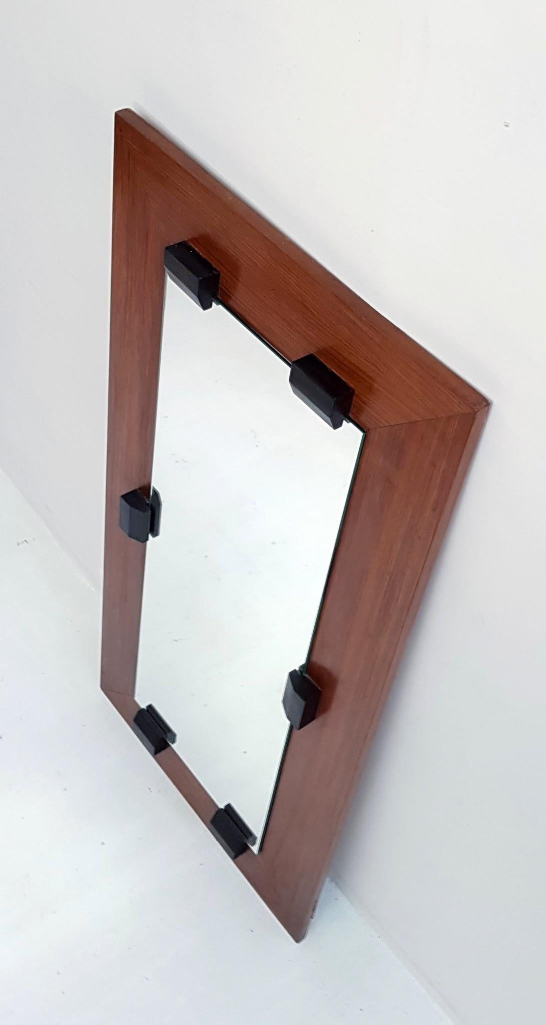 1960s rectangular mirror in walnut in a strict design from the late 1960s.