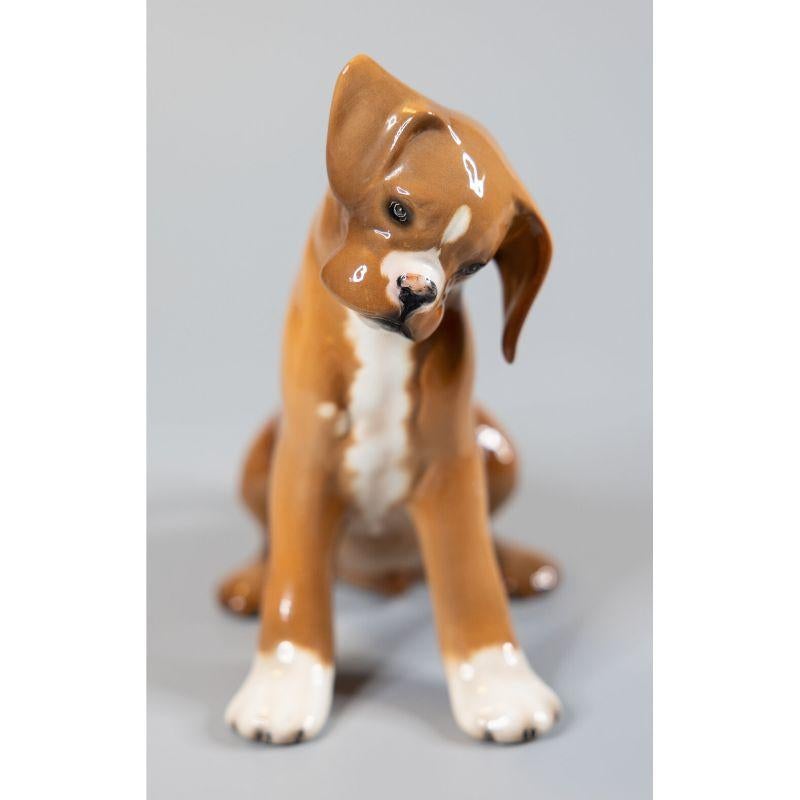A fine vintage hand painted boxer pup made by Ronzan in Bassano, Italy, circa 1950. Signed on reverse. This charming dog is beautifully hand painted with fine details, especially evident in his sweet face. It would be the perfect gift for the dog