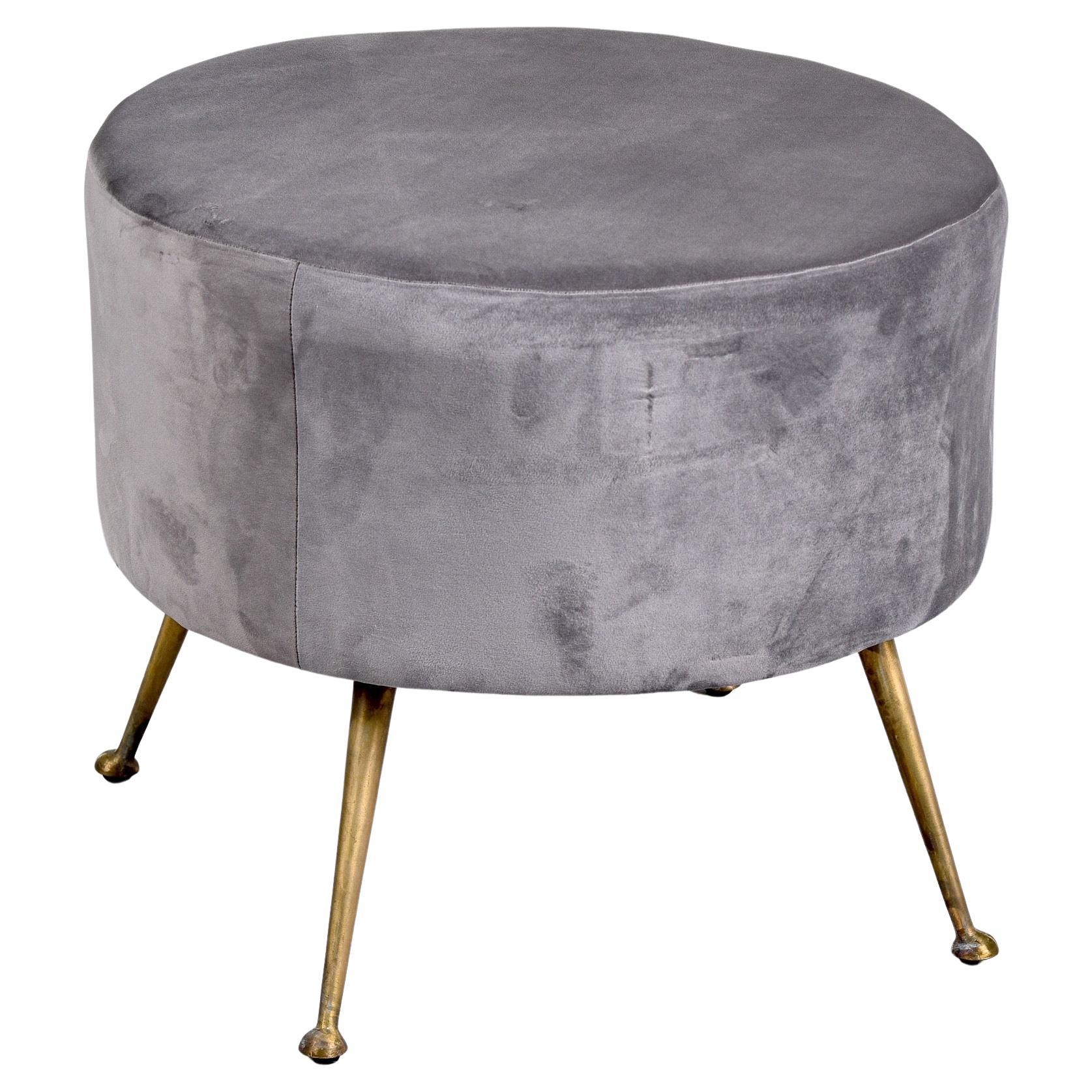 Circa late 1950s / early 1960s Italian round stool with slender brass legs and newer pale gray velvet upholstery. Unknown maker.  Can be shipped via parcel service.
 