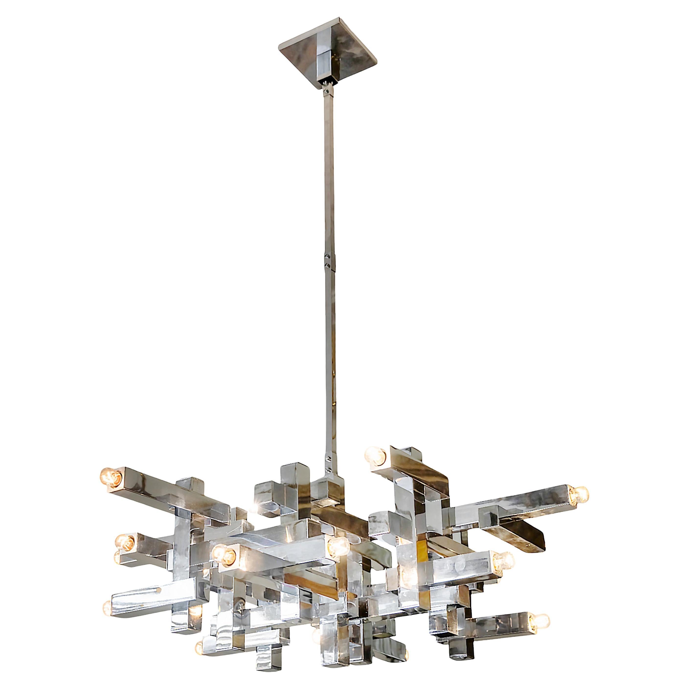 Italian mid-century chandelier Metric by Sciolari from 1970s.
The chandelier is made in chrome.
This chandelier includes 18 pieces of E14 bulbs.
It is in a very good original vintage condition.

