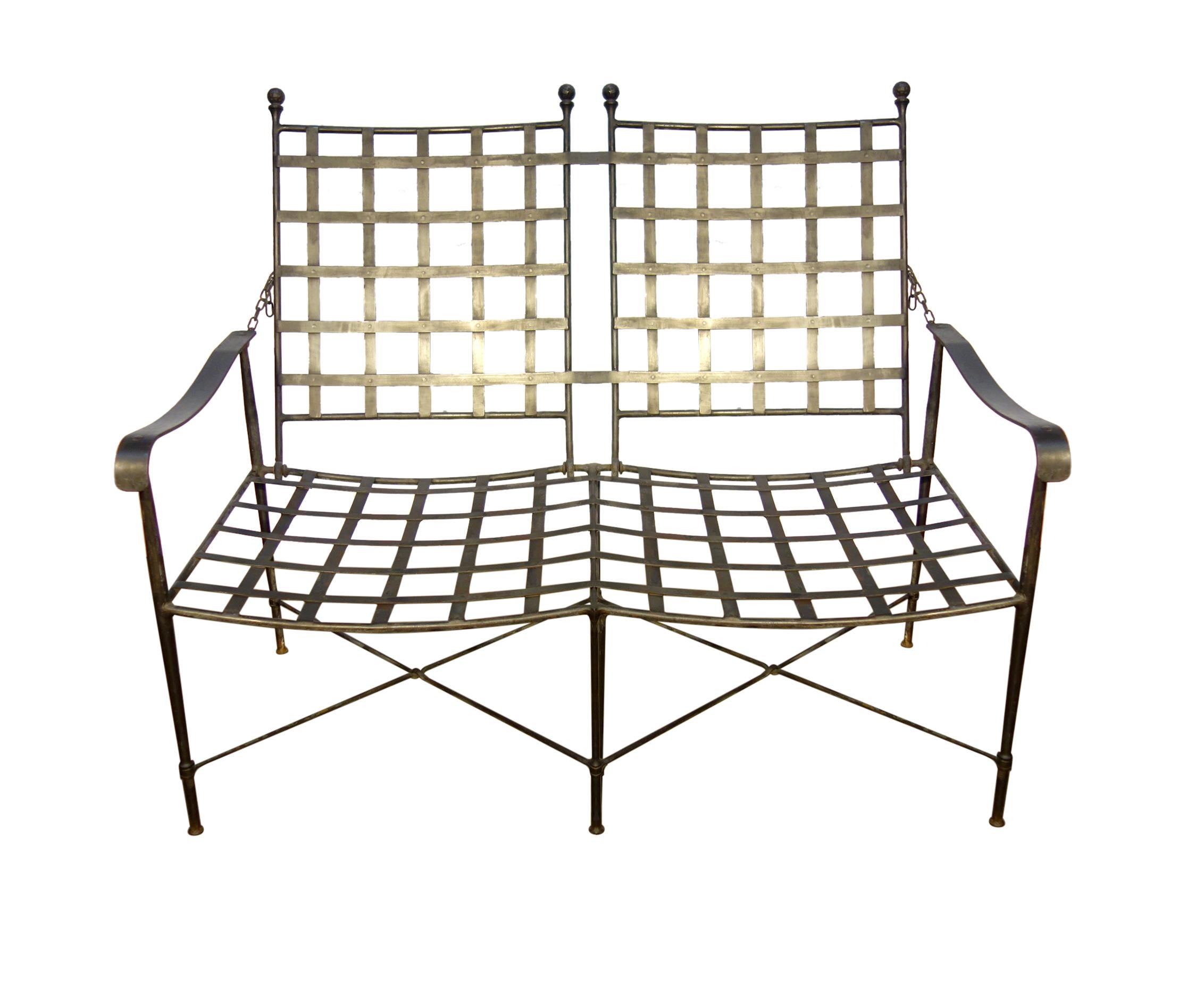 Exceptional Italian set of handcrafted hammered wrought iron chairs and reclining 2-seat bench with original patina. Welded frames. Welded lattice seats & riveted lattice backs are contoured for comfort. Hammered ball finials. Superb sleek design -