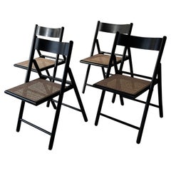 Mid-Century Italian Set of Four Caned Folding Chairs, 1970s Mid-Century Italian Set of Four Caned Folding Chairs, 1970s