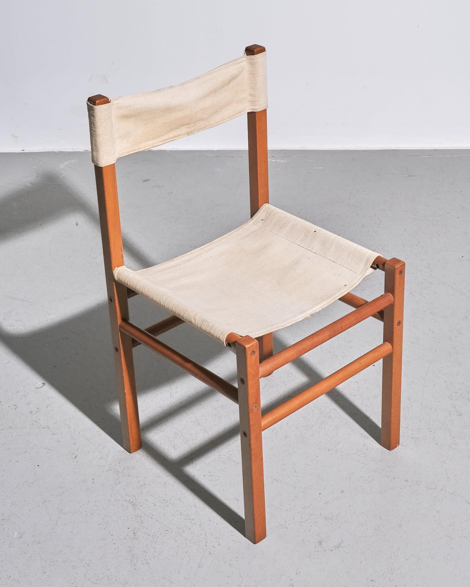 Set of Fourteen Italian Dining Chairs, c. 1970s

A set of fourteen dining chairs made in Italy in the 1970s. Each chair features a sturdy wood frame with an upholstered seat and backrest for comfort and practicality.
With their classic aesthetic and