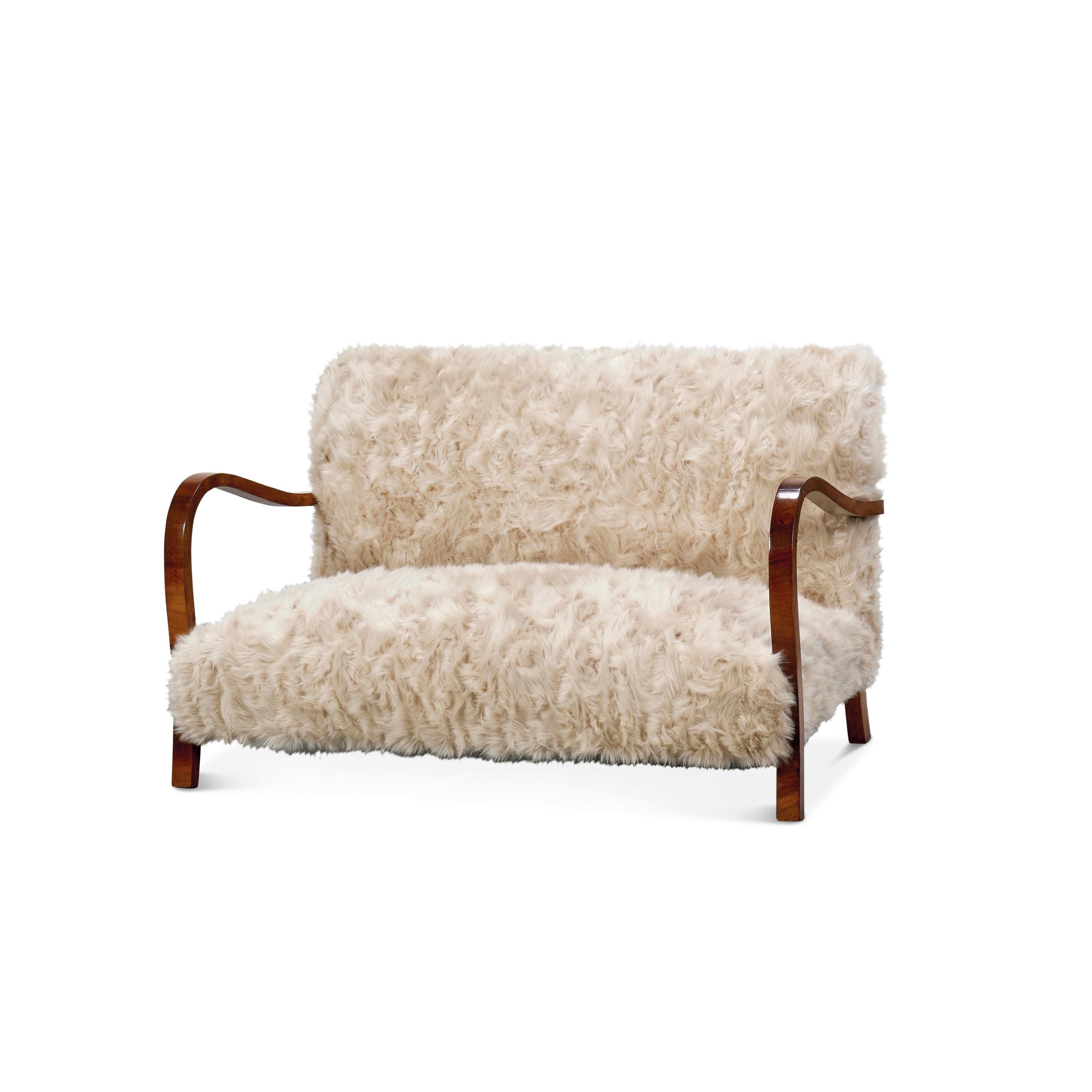 Mid-Century Sofa from 1950s Italy. Upholstered recently in a very soft Faux sheep wool, 
This cozy settee would go beautifully at the end the bed or any other seating area.
