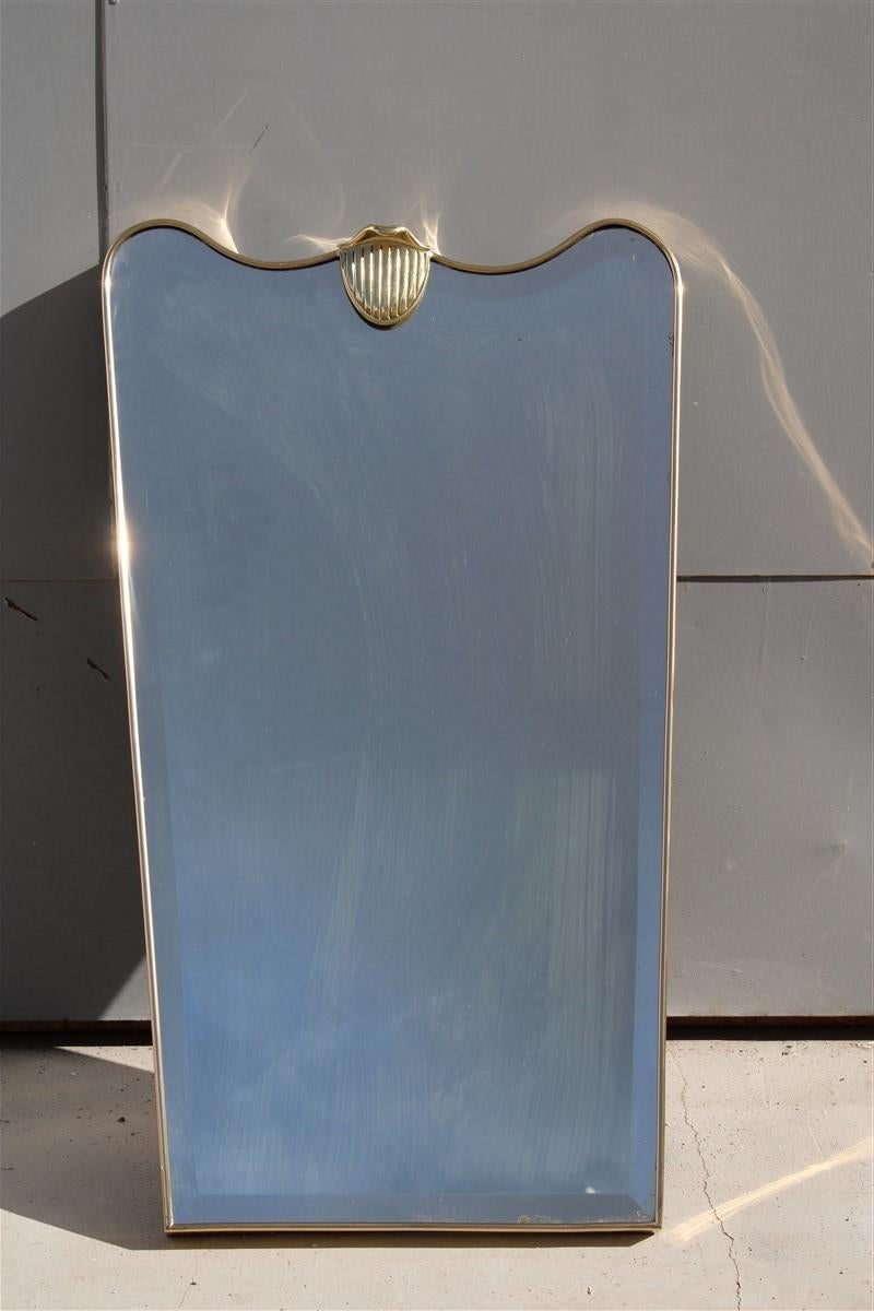 Mid Century Italian Shaped Mirror in solid Brass and ground mirror 
lower width 41 cm.
      