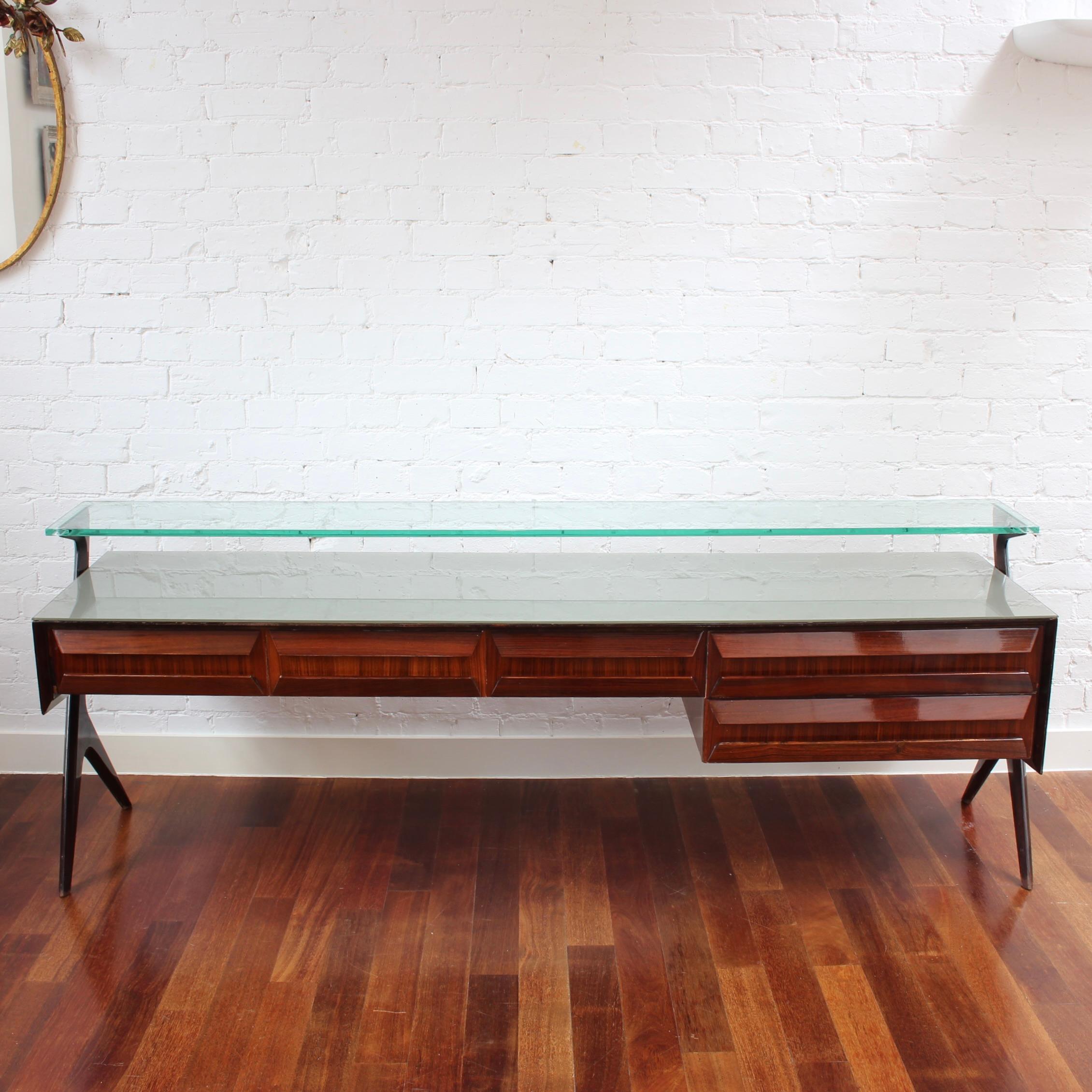 Charming sideboard designed by Vittorio Dassi made in Italy in the middle of the 20th century. This wonderful sideboard was rendered in veneer woods. It has five drawers configured both horizontally and vertically under the horizontal surface. An