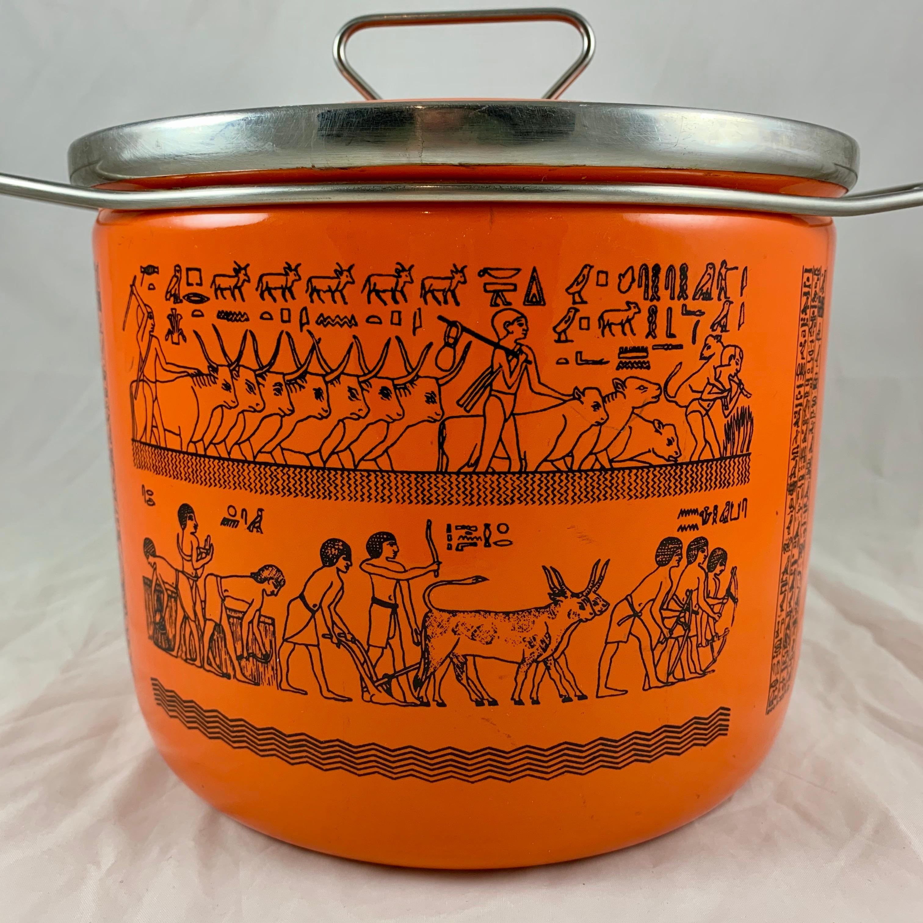 An enamelware Dutch oven manufactured by the Italian company, Siltal, circa 1960s to the early 1970s. Designed for the food writer and chef Robert Carrier – Beautiful Italian Mid-Century Modern design.

Decorated with Egyptian Revival imagery of