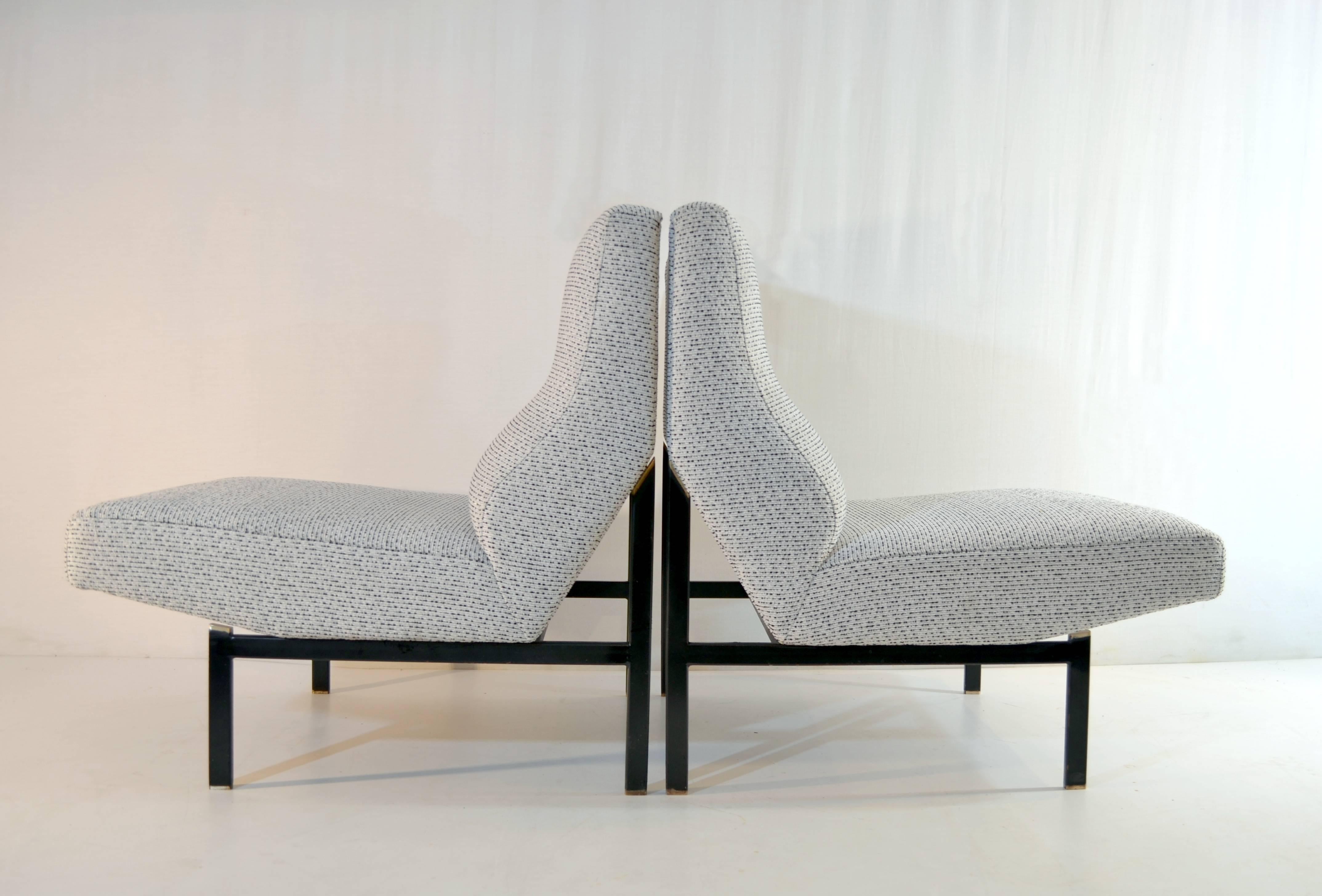 A pair of Italian slipper lounge chairs which has recently been professionally reupholstered in a strong quality fabric in black and white so called 