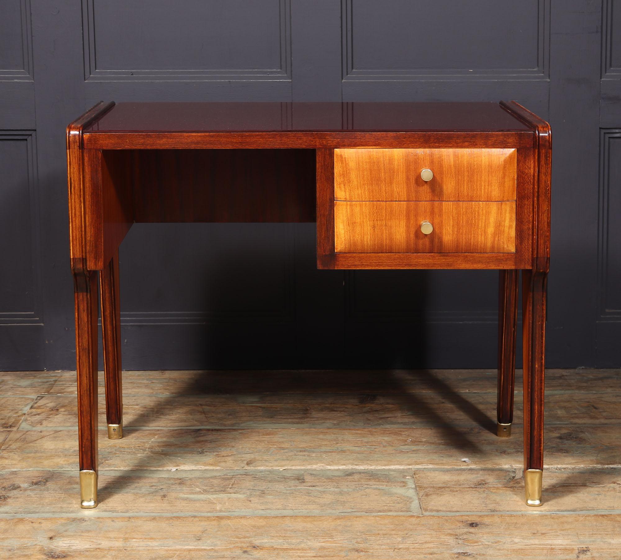DESK BY VITTORIO DASSI
Introducing a stunning piece of mid-century Italian design, the desk created by renowned craftsman Vitorrio Dassi in the 1950s is a true gem. With its minimalist aesthetic, this desk features two functional drawers and a