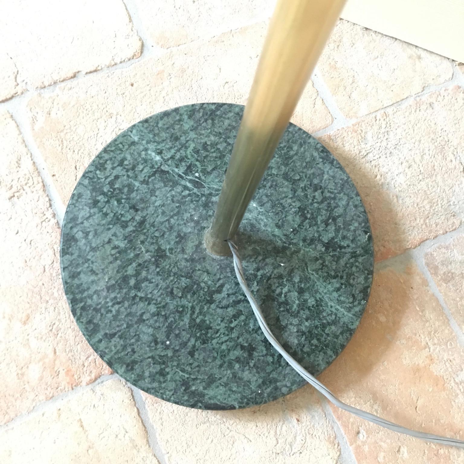 Classic Italian midcentury standing floor lamp. Top arm pivots with wonderful brass joint. Sits on a green marble base. Minor colour fading to metal shade, see picture. Floor height to elbow 42
