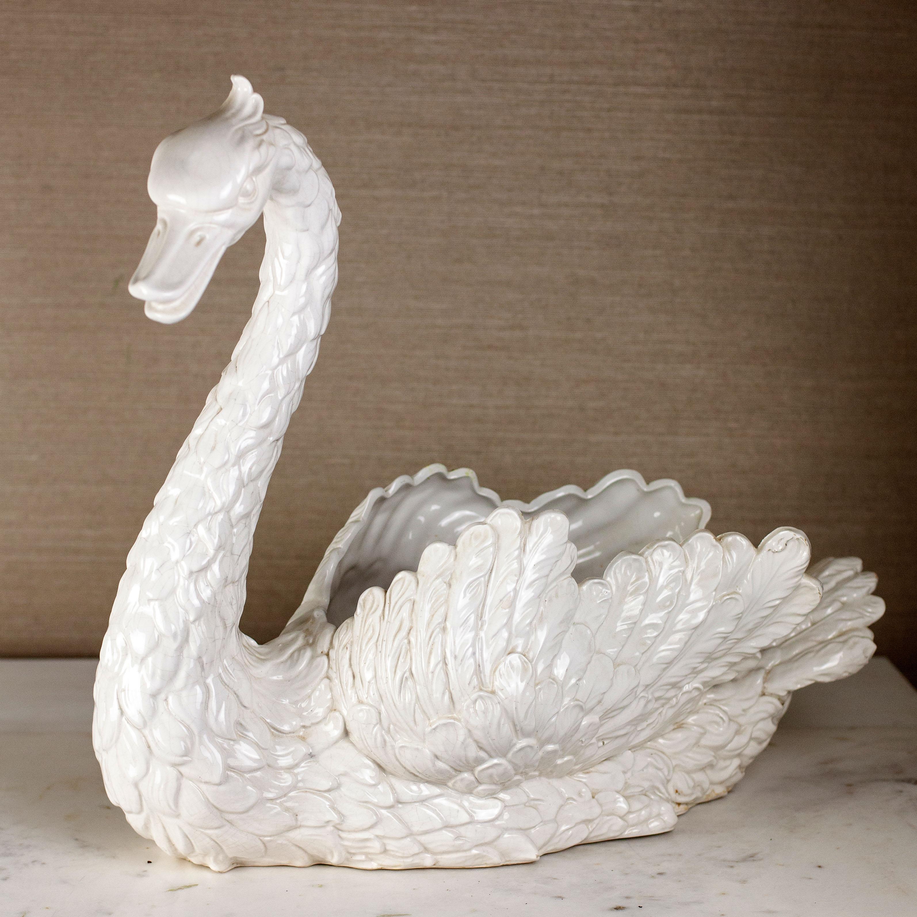 We presents for your consideration, this trumpeting cob. This male swan from the Italian designers of the mid-century will add majesty to any dining room table. Filled with a floral celebration or mixed fruits, this centerpiece will surely delight