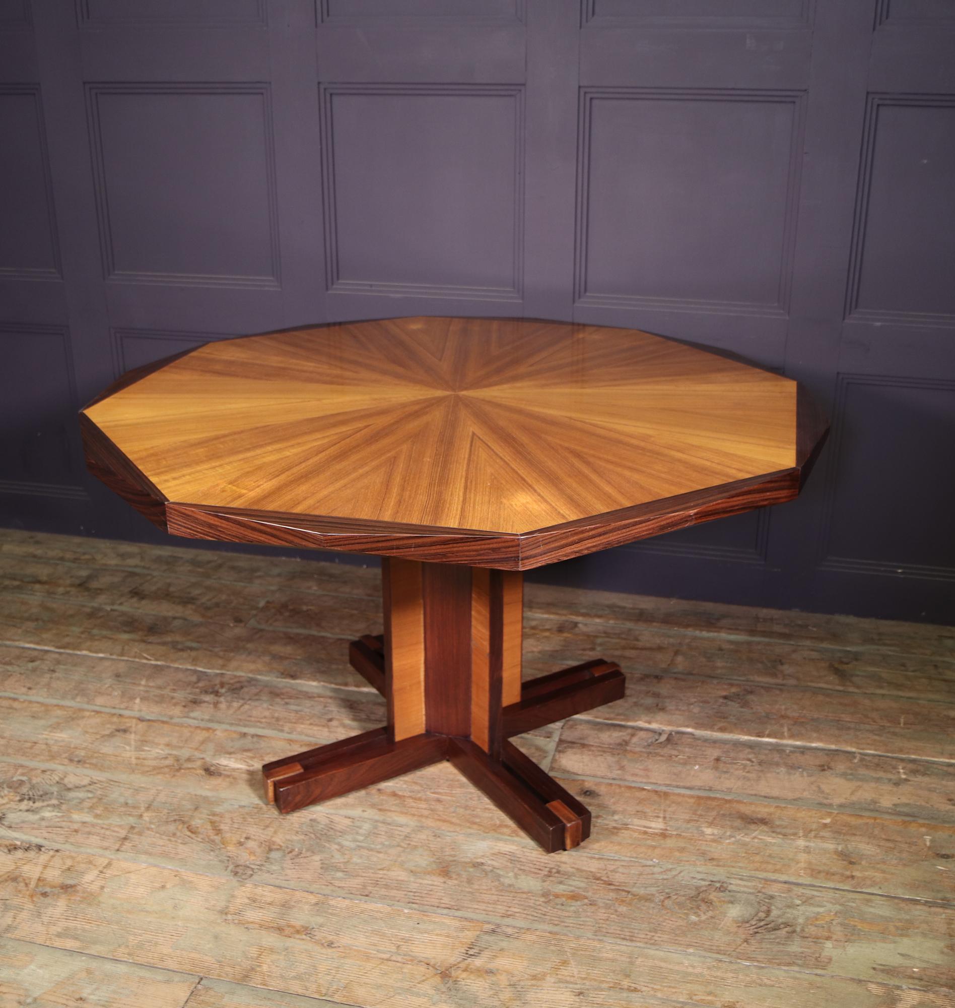 A Mid century table produced in Italy in the 1950’s in mixed timbers with a segmented circular 16 sided top. The table is in excellent original condition and has benefited from a wax finish

Age: 1950

Style: Mid Century

Material: Mixed