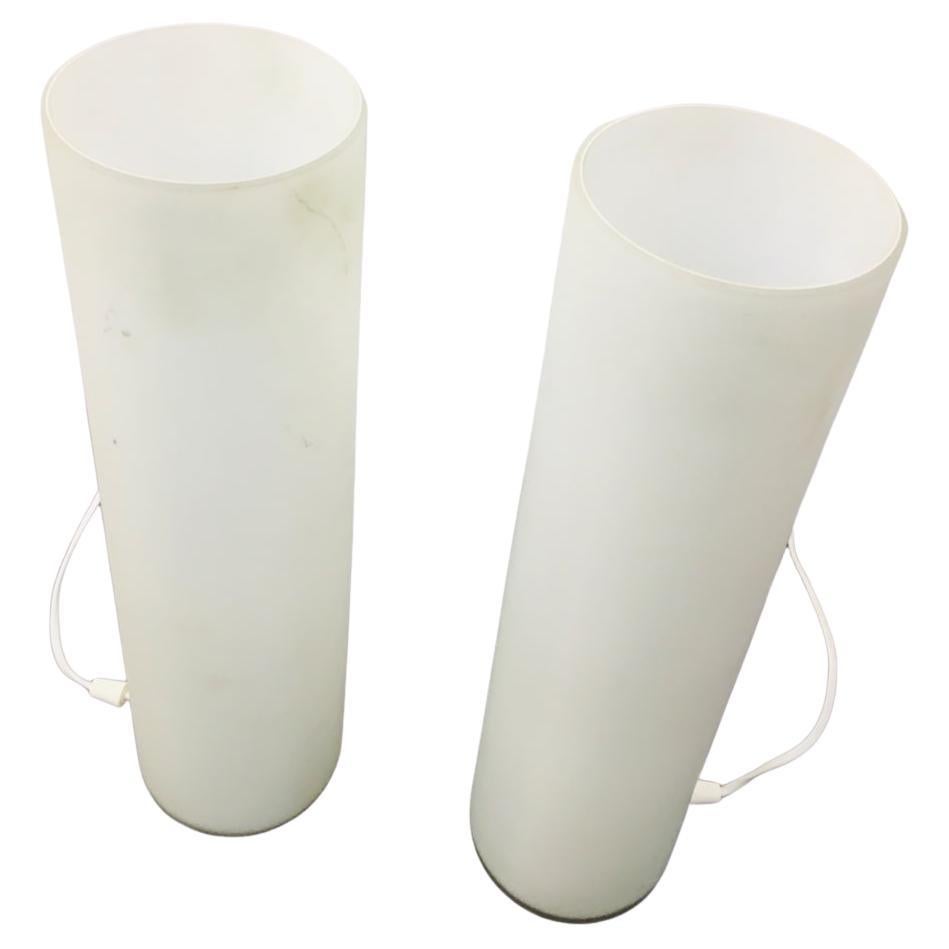 A pair of special table lamps made of matte white milk glass from the 1960's Italian design. This is an immaculate mid-century glass white lamp with a cylindrical body that can fill home with cozy light. This vintage Italian design table lamp is in