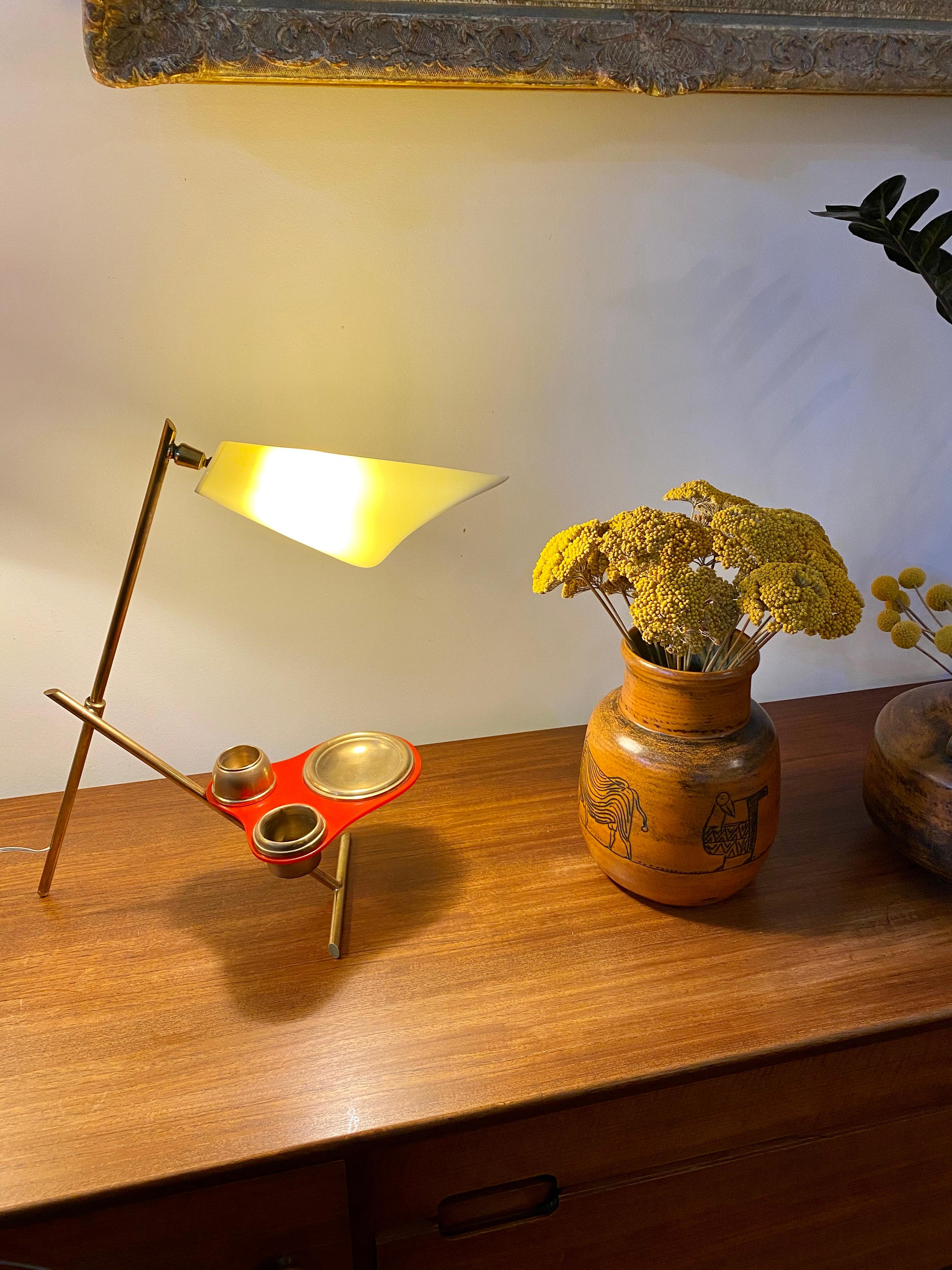 An entirely original midcentury Italian table lamp with brass stand and desk-organiser receptacles (circa 1950s). Incredibly stylish and modern, this chic table / desk lamp puts the spotlight on those things important to you. It has a dashing red