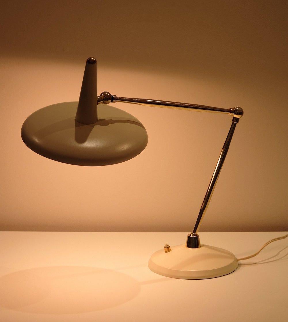 Italian task lamp from the 1960’s. Triple jointed. Takes 2x 40 watts max G-16.5 candelabra incandescent bulbs recommended or higher if LED/CFL.
