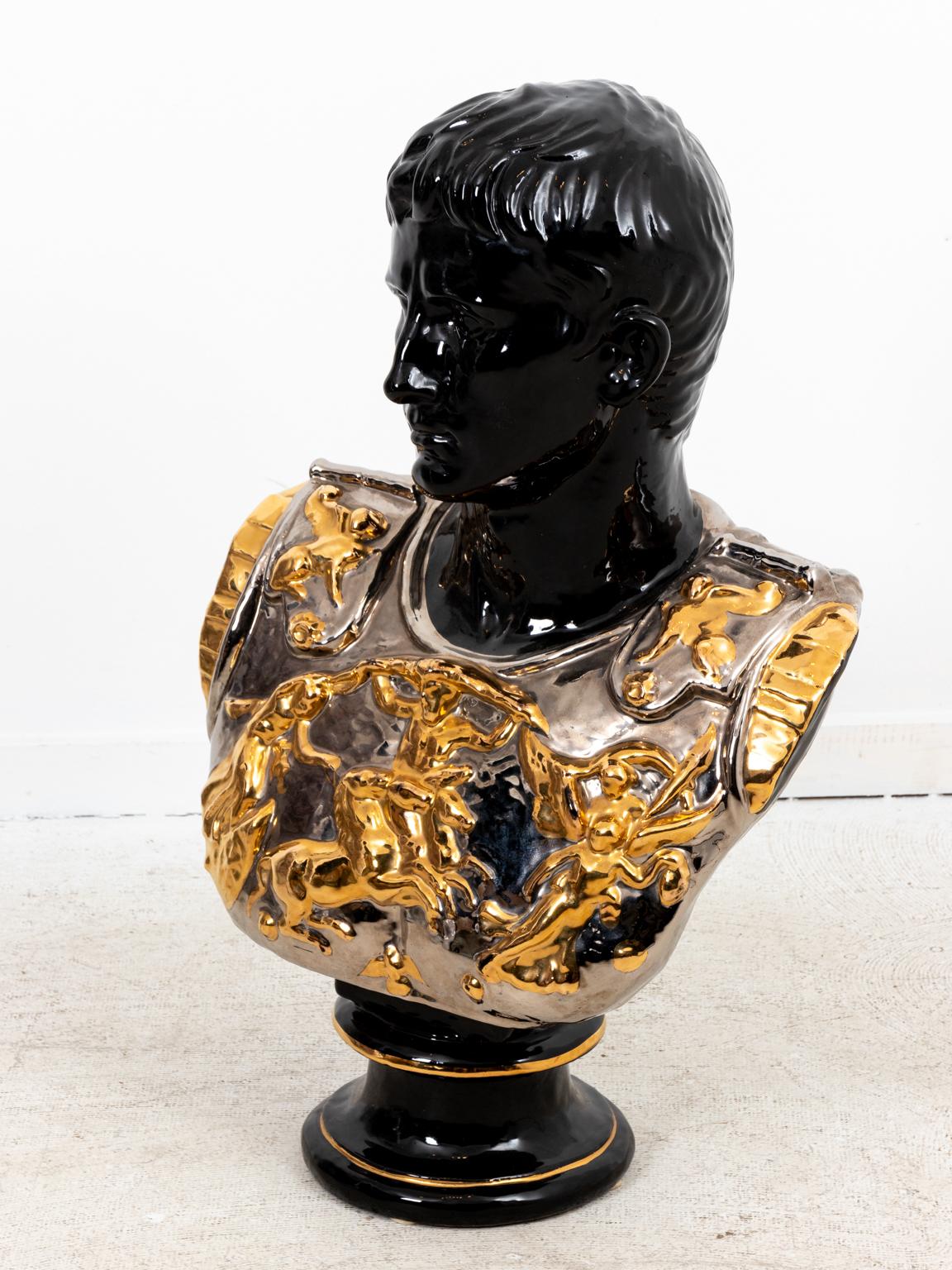 Circa 1970s monumental mid-century terra cotta bust depicting a Roman soldier wearing armor in glossy black finish with silver and gold glazes on the armor. Signed and marked 