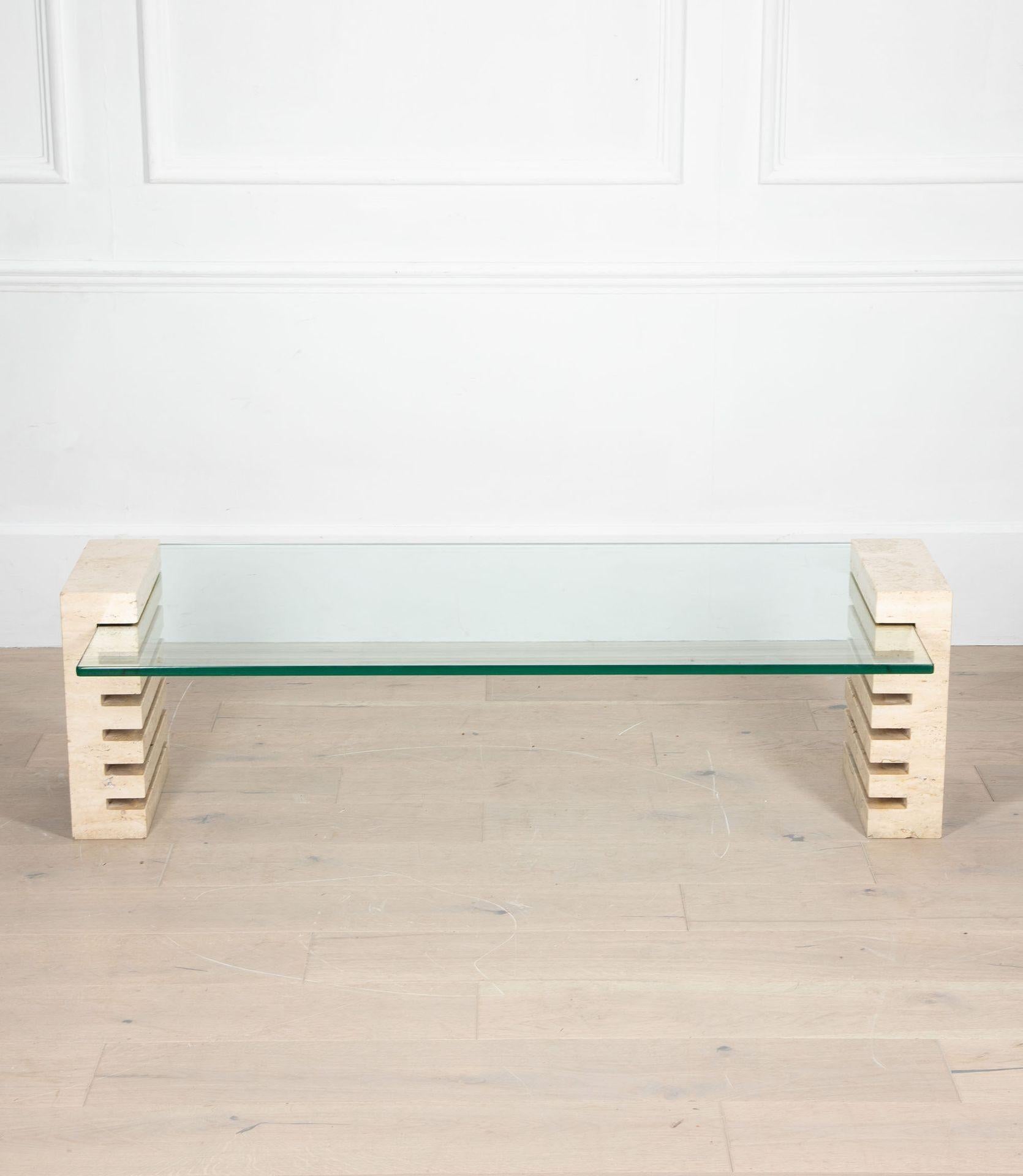 Mid-Century Italian travertine coffee table.
With geometric legs and a glass top.
Height is adjustable. Circa 1970.